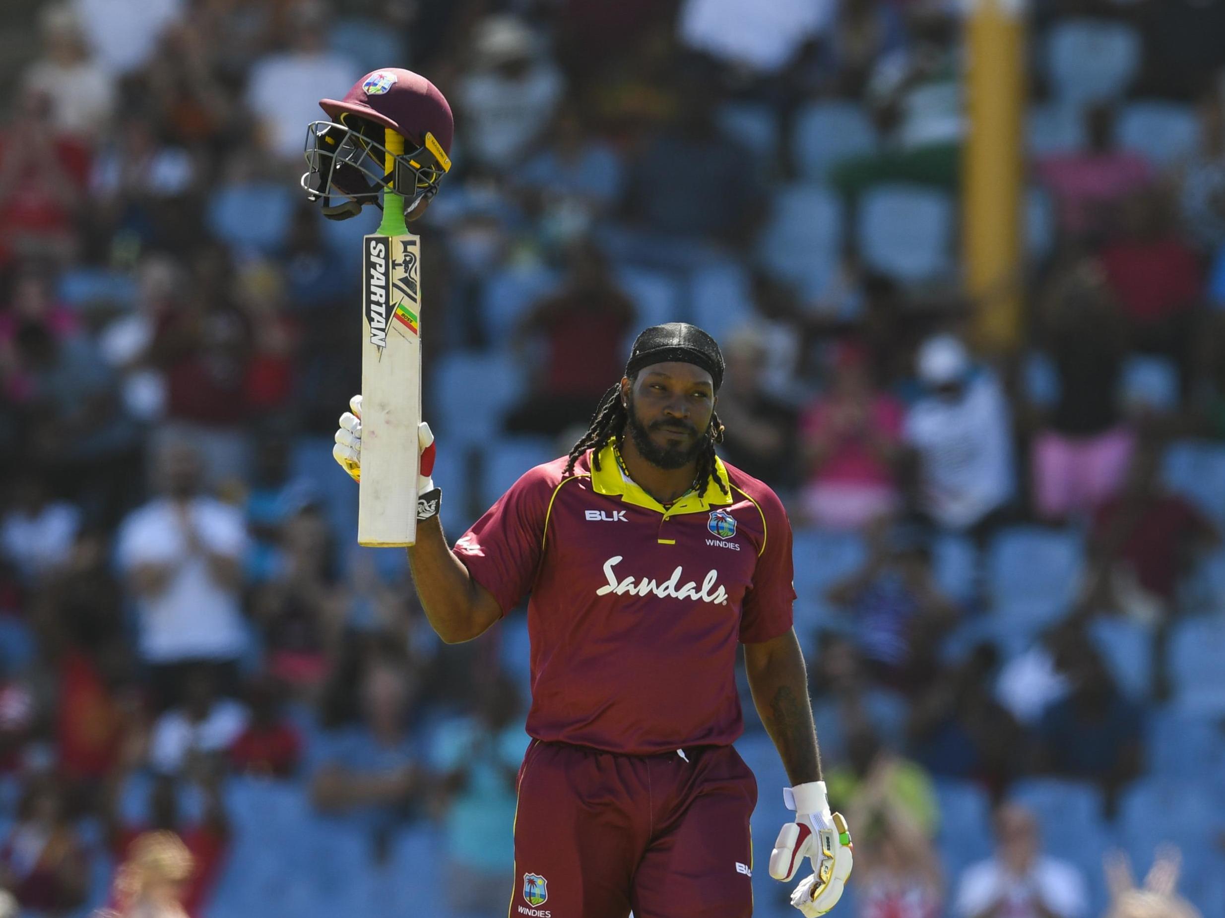 Chris Gayle celebrates reaching his half century