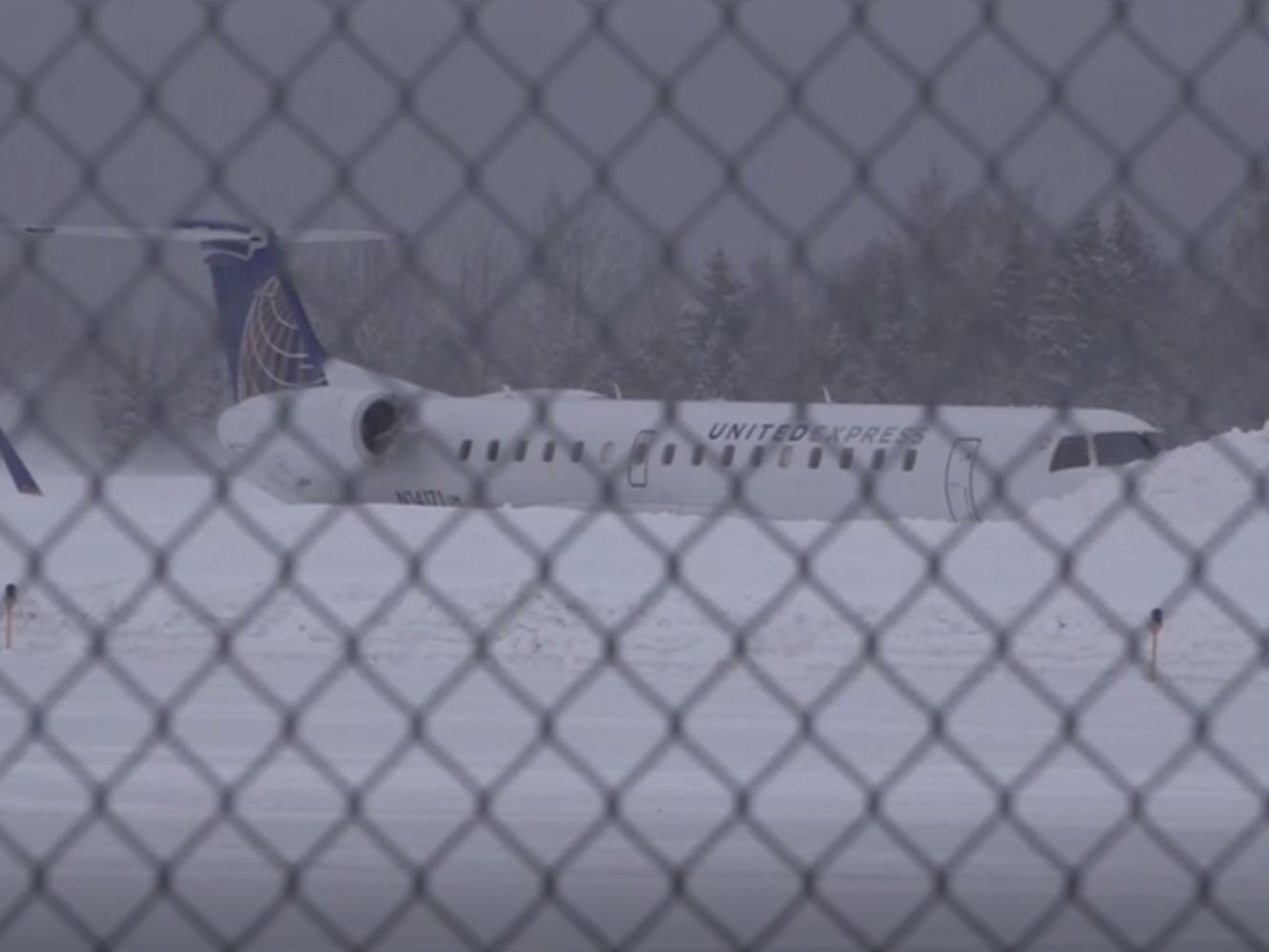 A pilot and four passengers suffered minor injuries when the United Express flight veered off the runway