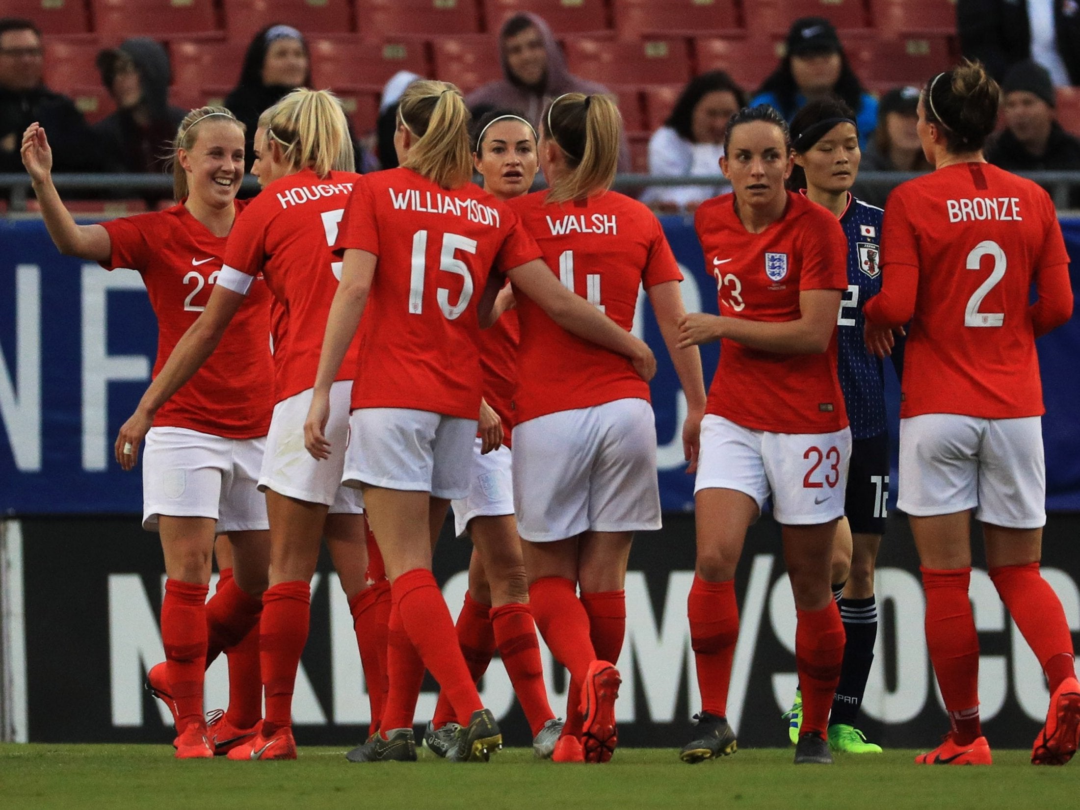 Beth Mead celebrates with teammates after scoring