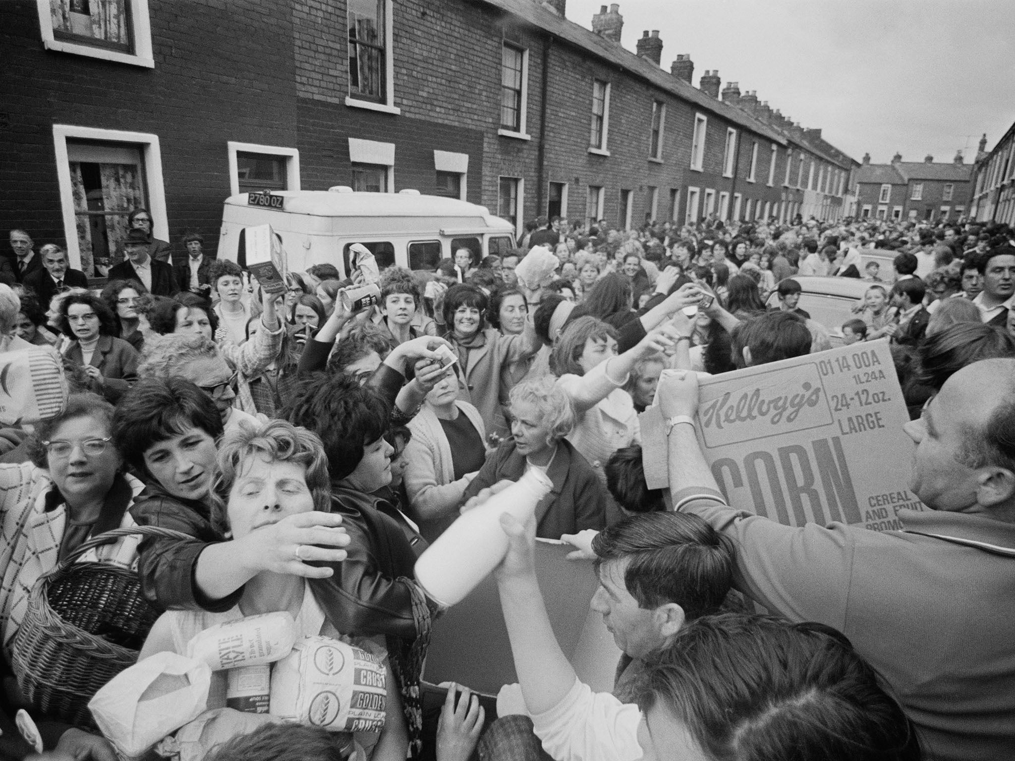 Irish women handing out food at a civil rights march in the Falls Road, Belfast in 1970 (Getty)