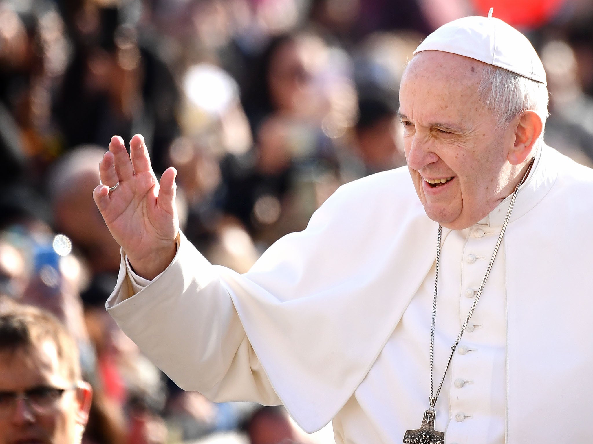 Pope Francis waves as he arrives for his weekly general audience at Saint Peter’s Square on February 27, 2019