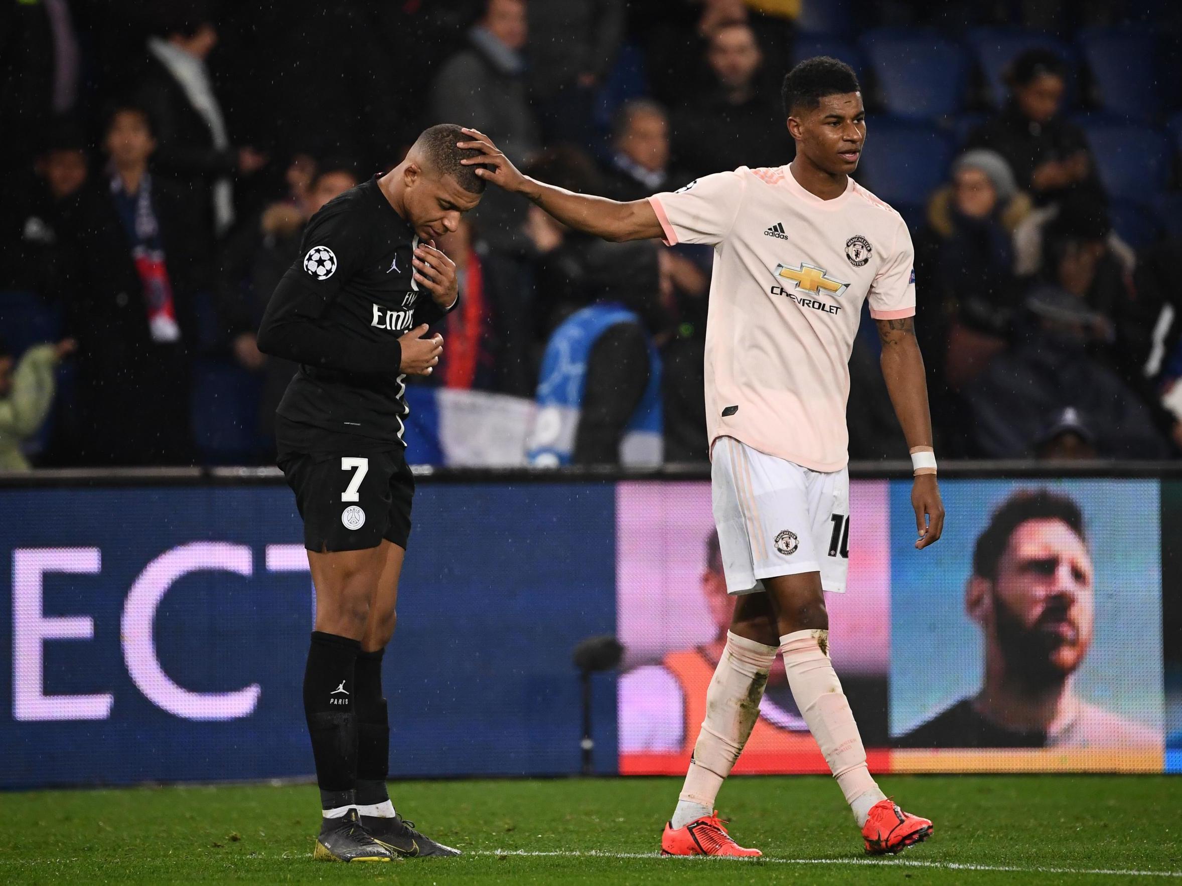 Marcus Rashford commiserates Kylian Mbappe at full-time