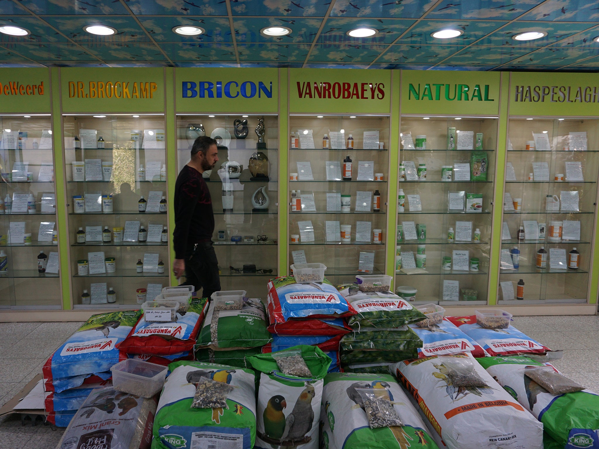 A pigeon store in Baghdad displays feed, vitamins, supplements and even herbal teas imported from Belgium that are designed to keep the birds in peak form (Washington Post/Tamer El-Ghobashy)