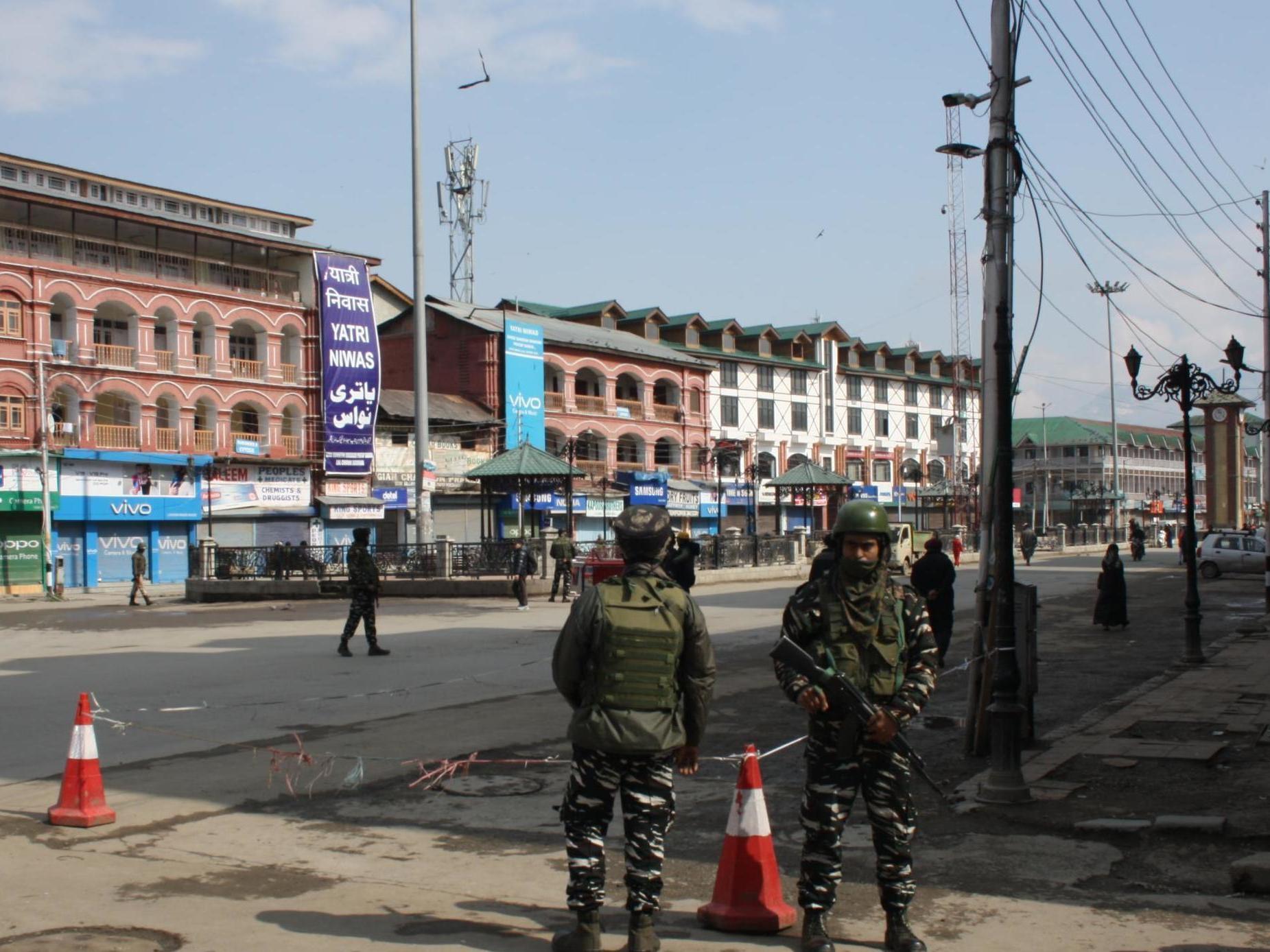 Soldiers stand guard in Srinagar