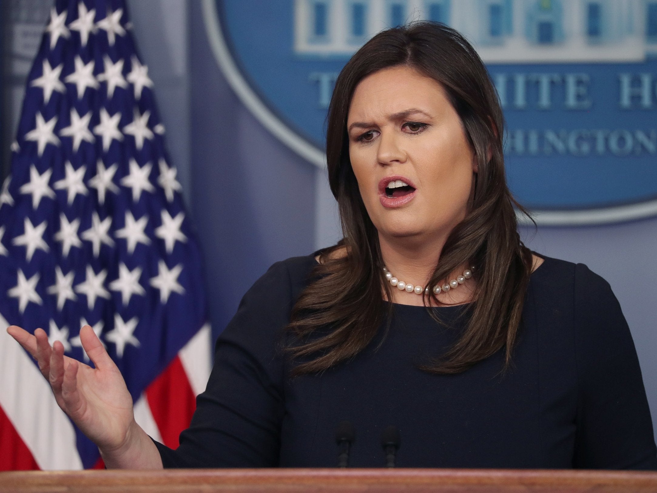 Former White House press secretary Sarah Sanders answers questions from reporters (Reuters)