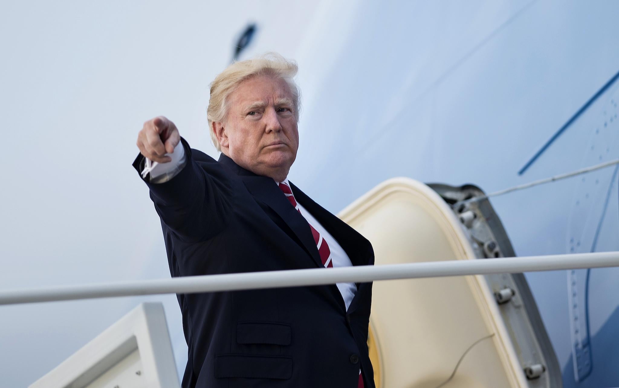 US President Donald Trump boards Air Force One at Andrews Air Force Base on October 7, 2017 in Maryland