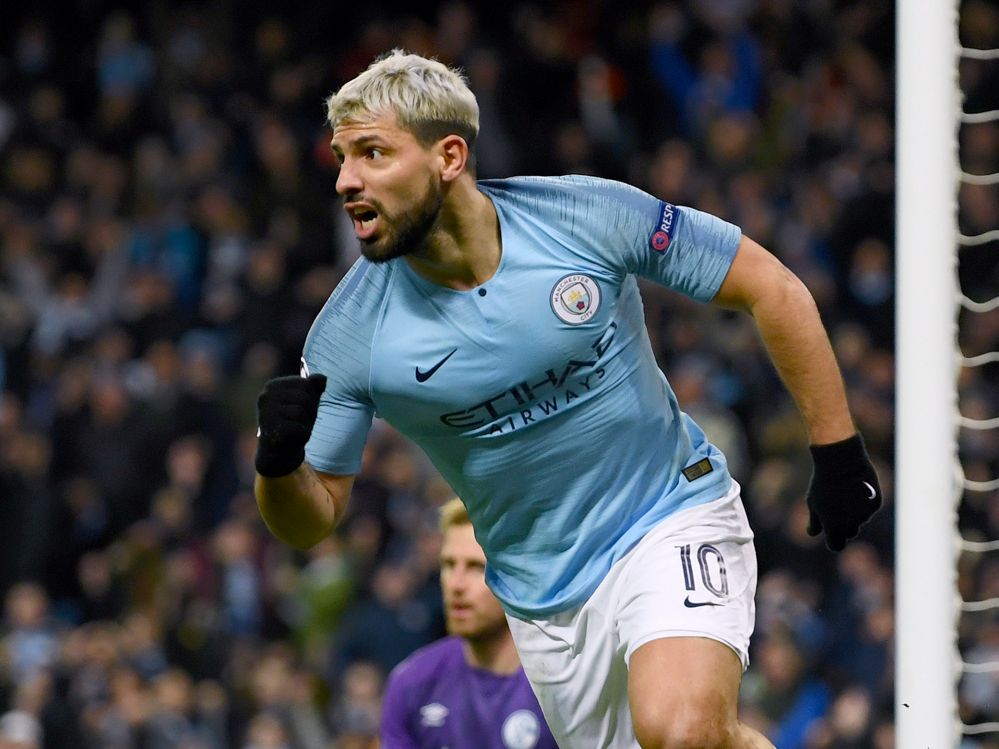 Sergio Aguero celebrates after setting City on their way