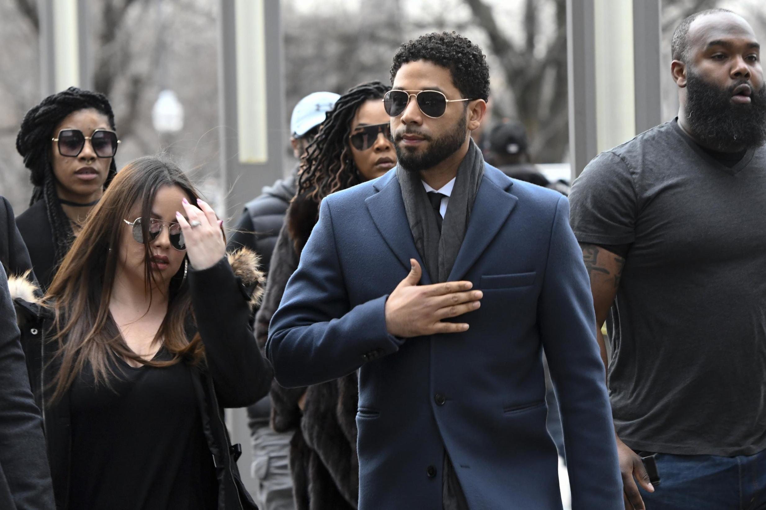 'Empire' actor Jussie Smollett, center, arrives at the Leighton Criminal Court Building for his hearing on Thursday, 14 March 2019, in Chicago.