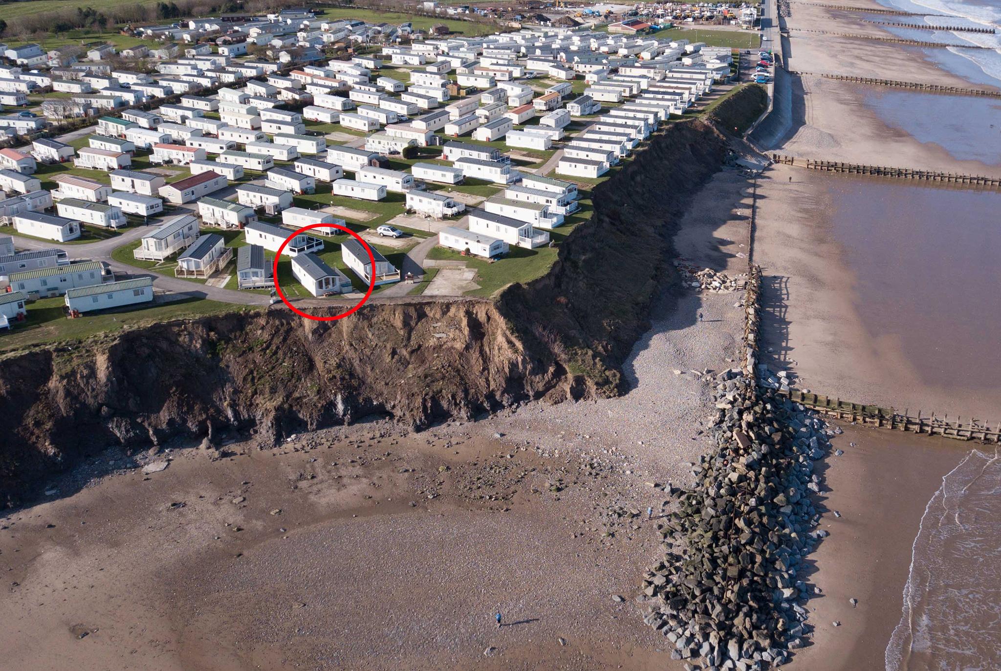 Homeowner Jenny Speight has owned four different properties at the site in the past 33 years and she is now facing the relocation of her current home (circled) due to the imminent threat from erosion