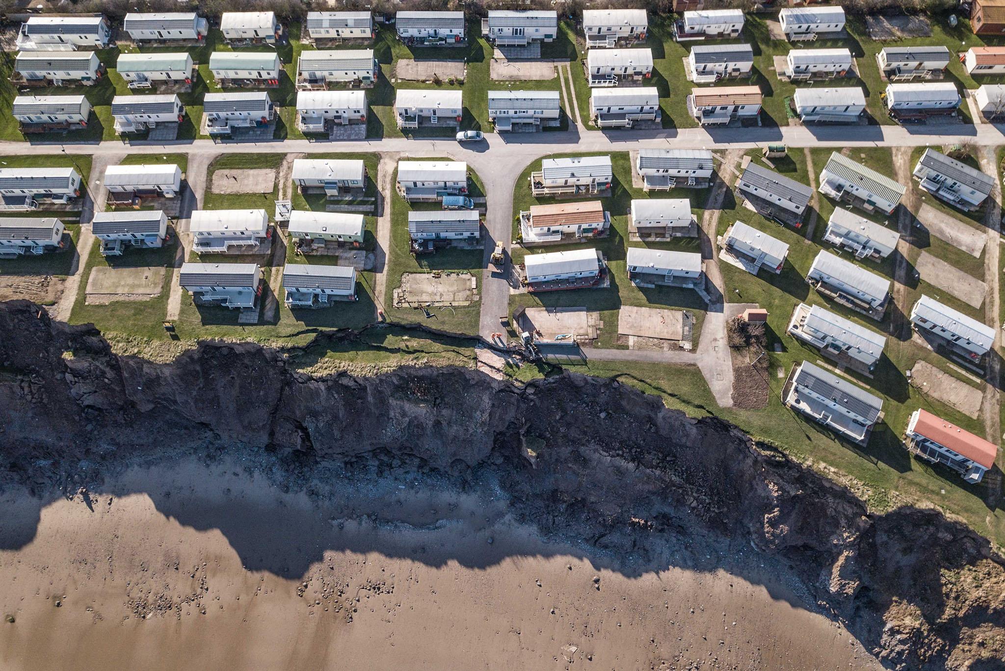 The coastline has been eroding at an annual average of seven and half feet – one year nearly thirty feet – and homes have already been removed to avoid collapse
