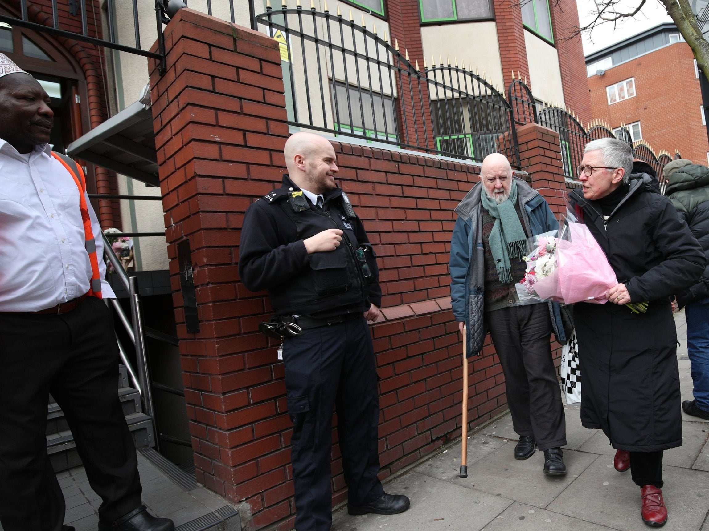 Barbara Smith arrives to leave flowers at Finsbury Park Mosque following Christchurch attacks