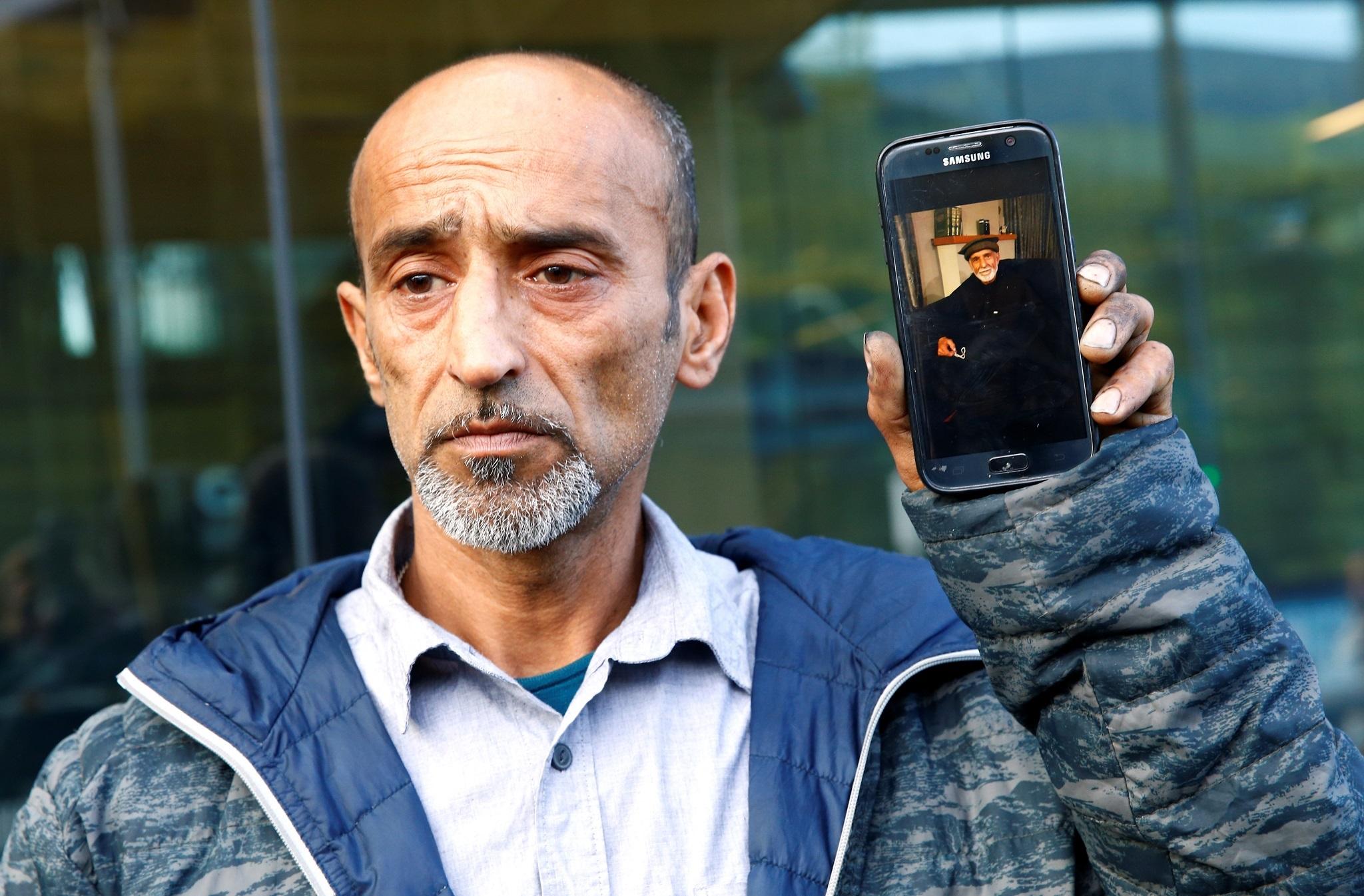 Omar Nabi speaks to the media about losing his father Haji Daoud Nabi, 71, in the mosque attack