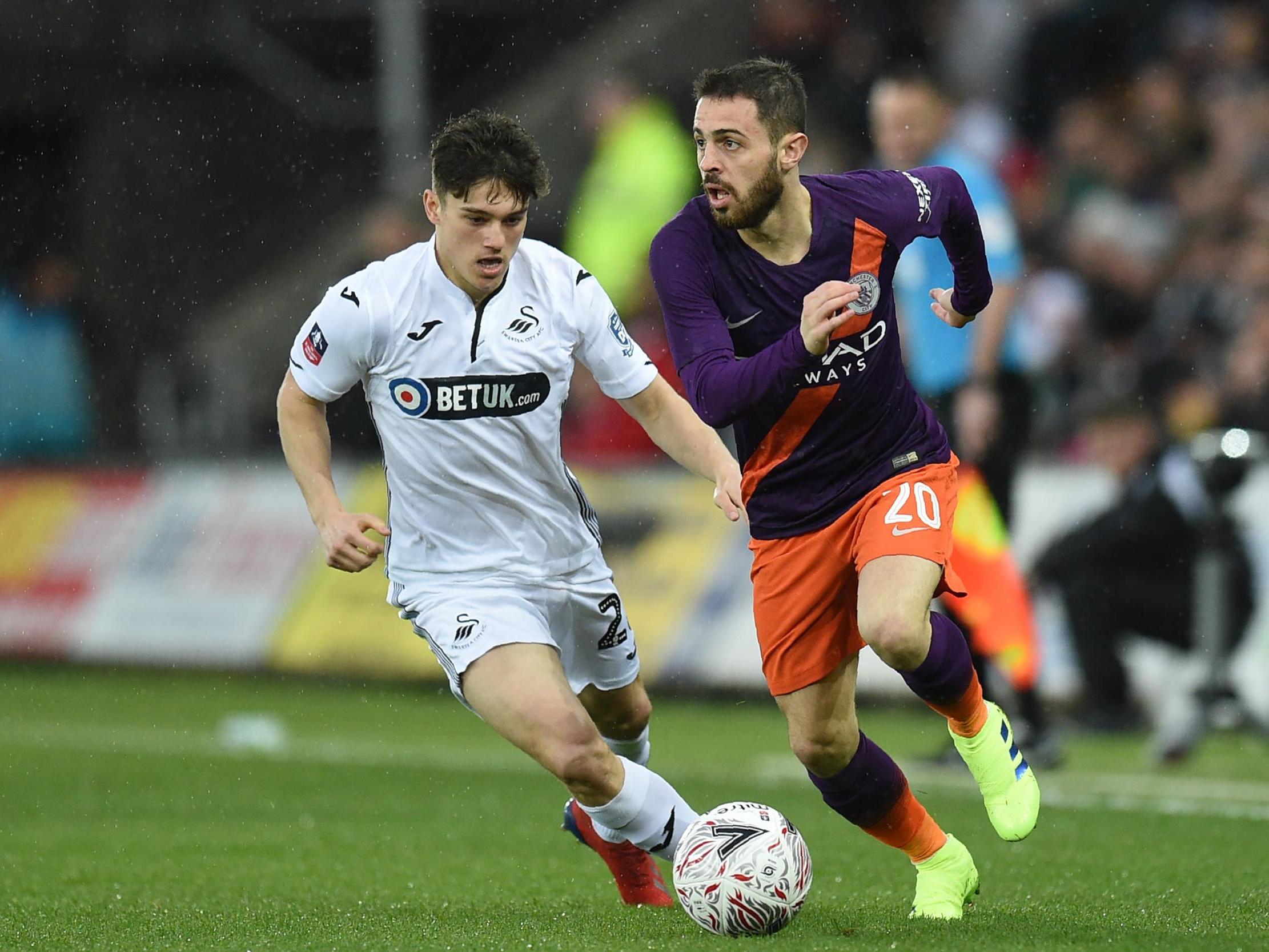 Bernardo Silva races to get away from Swansea's Daniel James