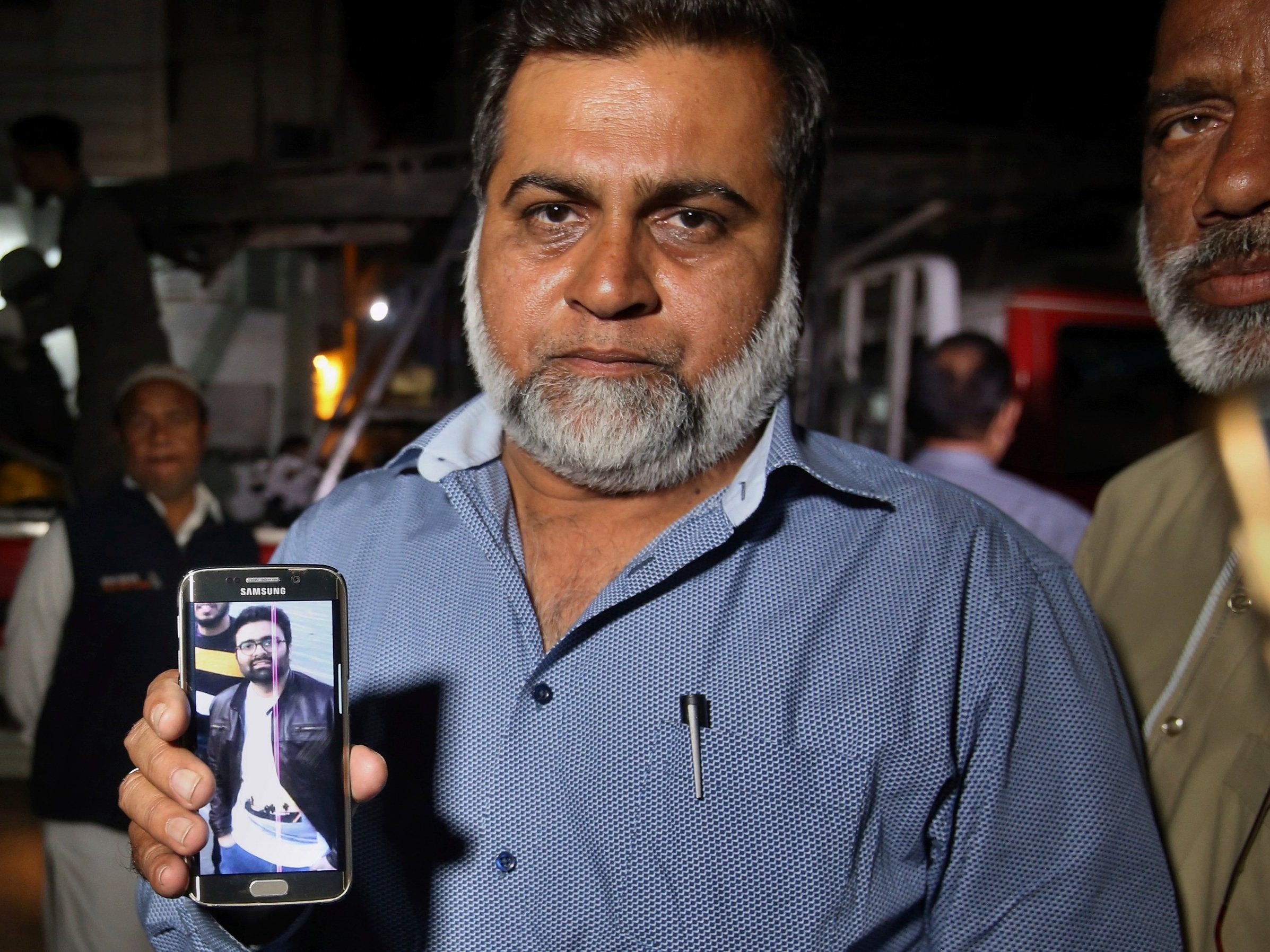 A relative shows a picture of Syed Areeb Ahmed, a Pakistani citizen who was killed the Christchurch mosque shooting.