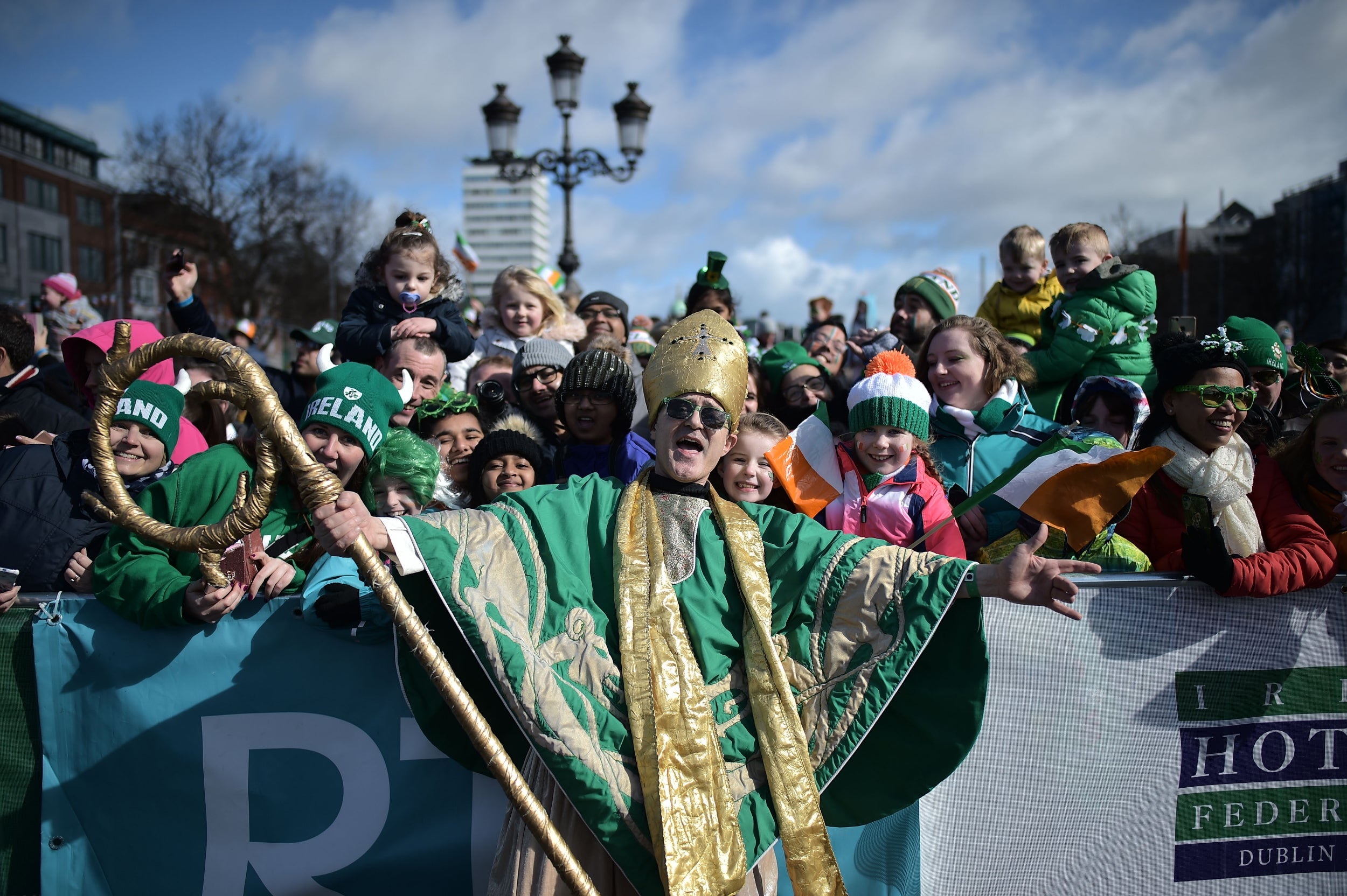 An actor playing the part of Saint Patrick leads the annual Saint Patrick's Day parade in Dublin, Ireland. Saint Patrick, the patron saint of Ireland is celebrated around the world on St. Patrick's Day. According to legend Saint Patrick used the three-leaved shamrock to explain the Holy Trinity to Irish pagans in the 5th-century after becoming a Christian missionary.