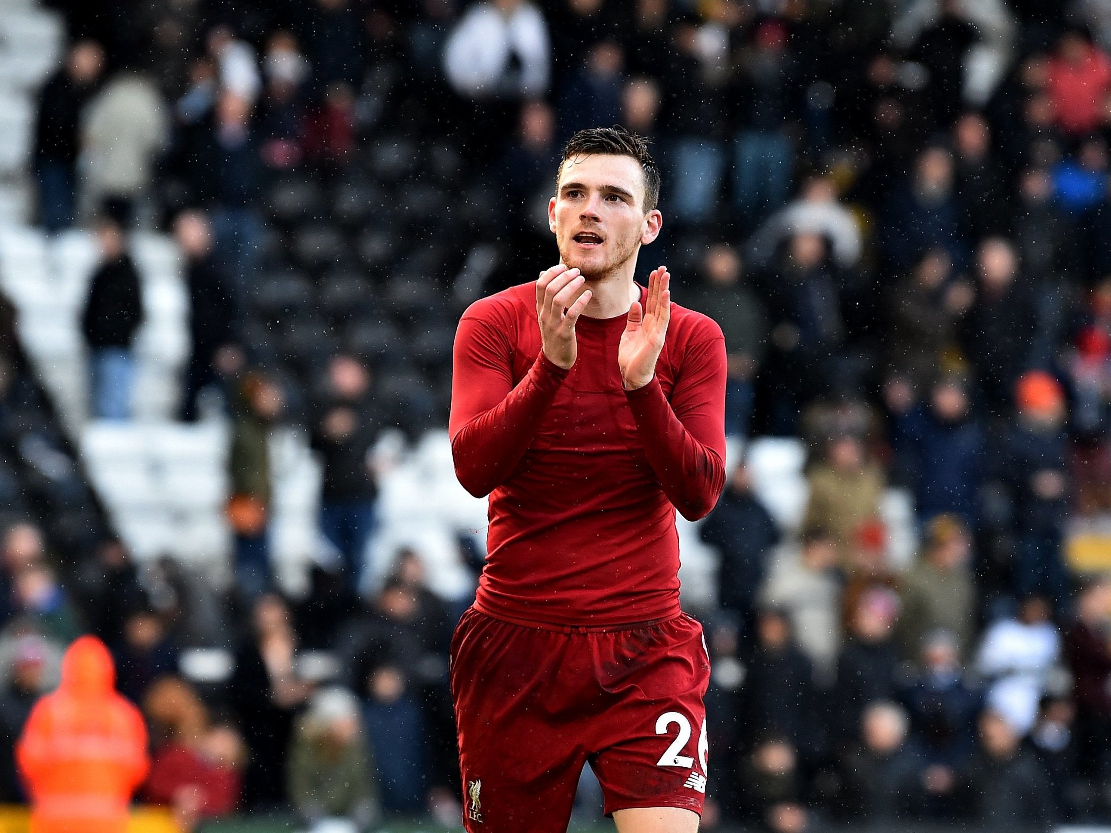 Andy Robertson applauds the Liverpool fans