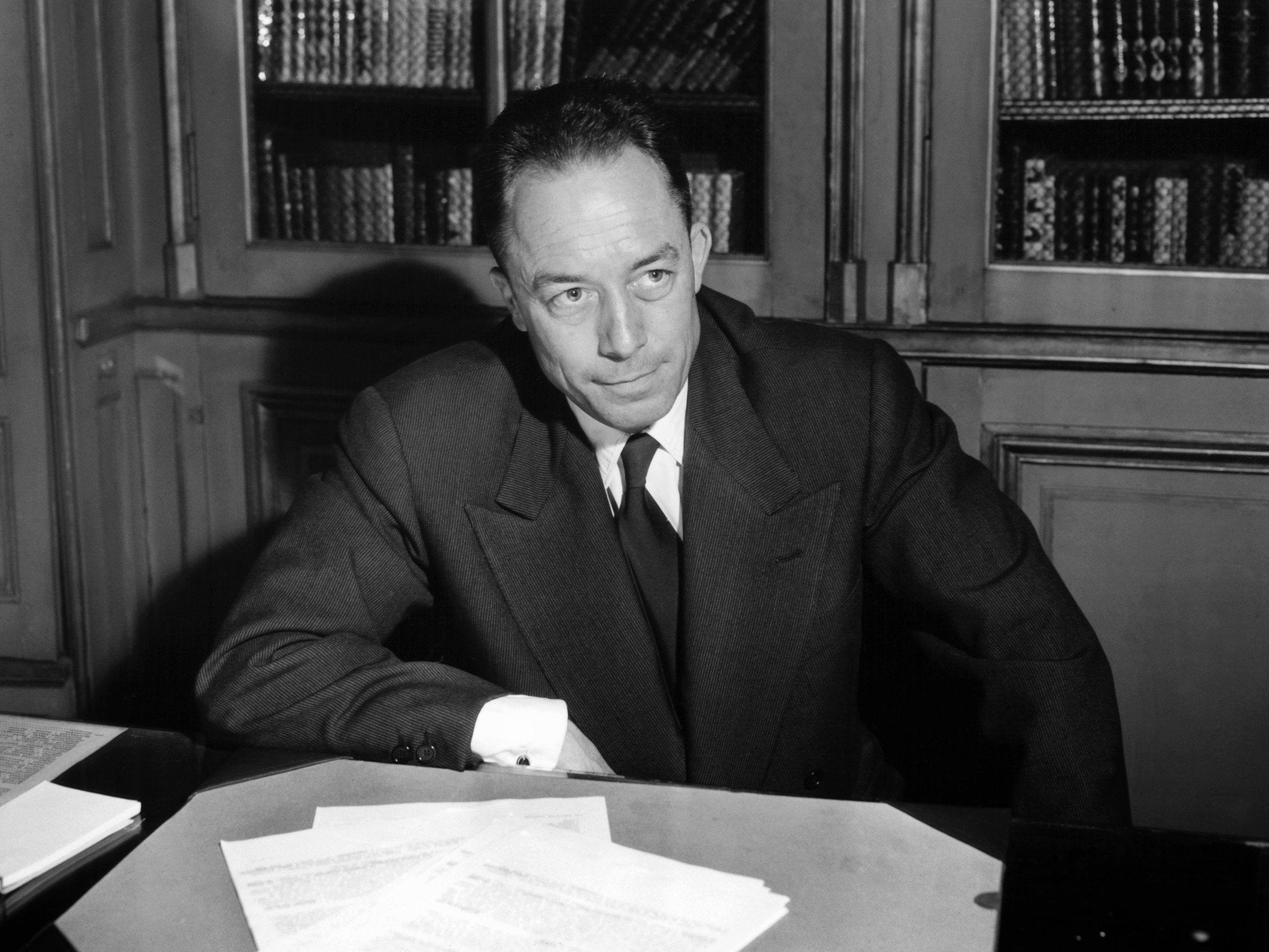 Posing for a portrait in Paris following the announcement of his Nobel Prize triumph in 1957