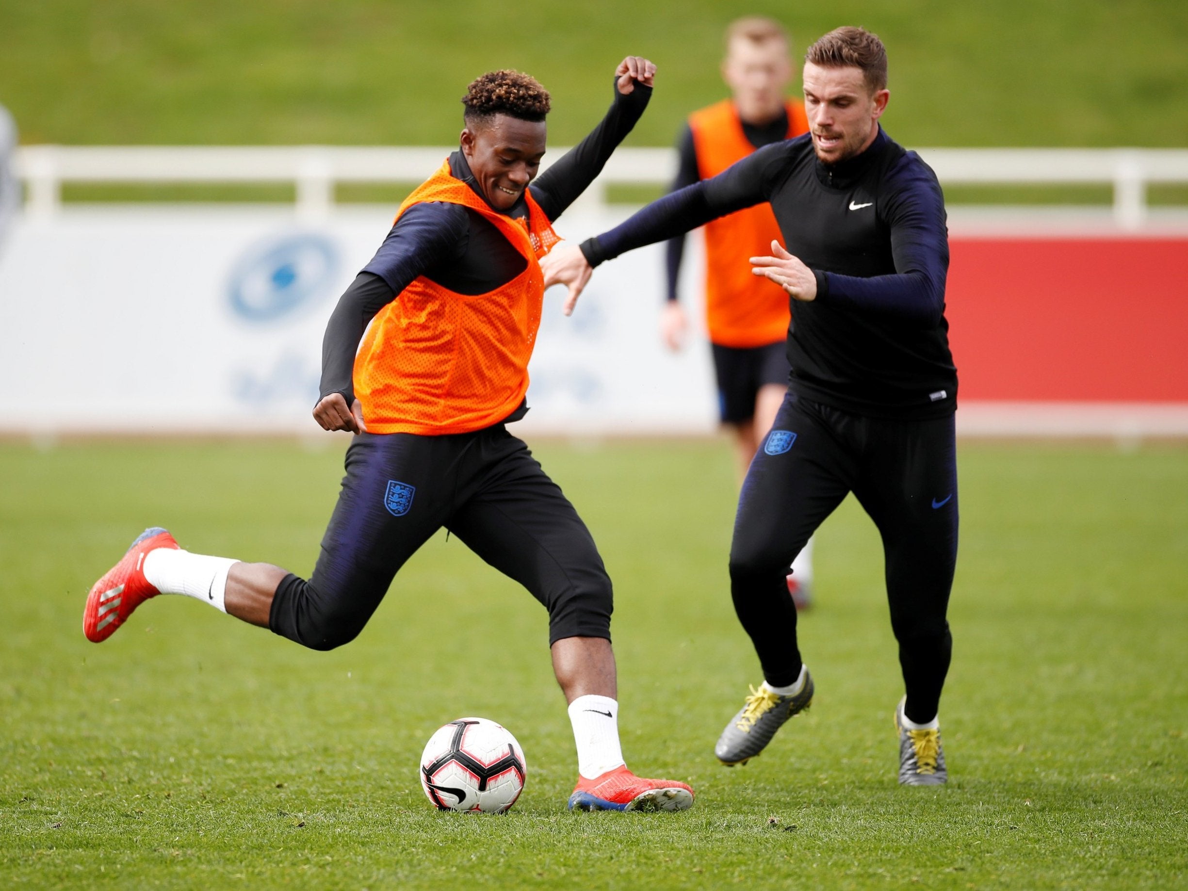 England’s Callum Hudson-Odoi with Jordan Henderson during training