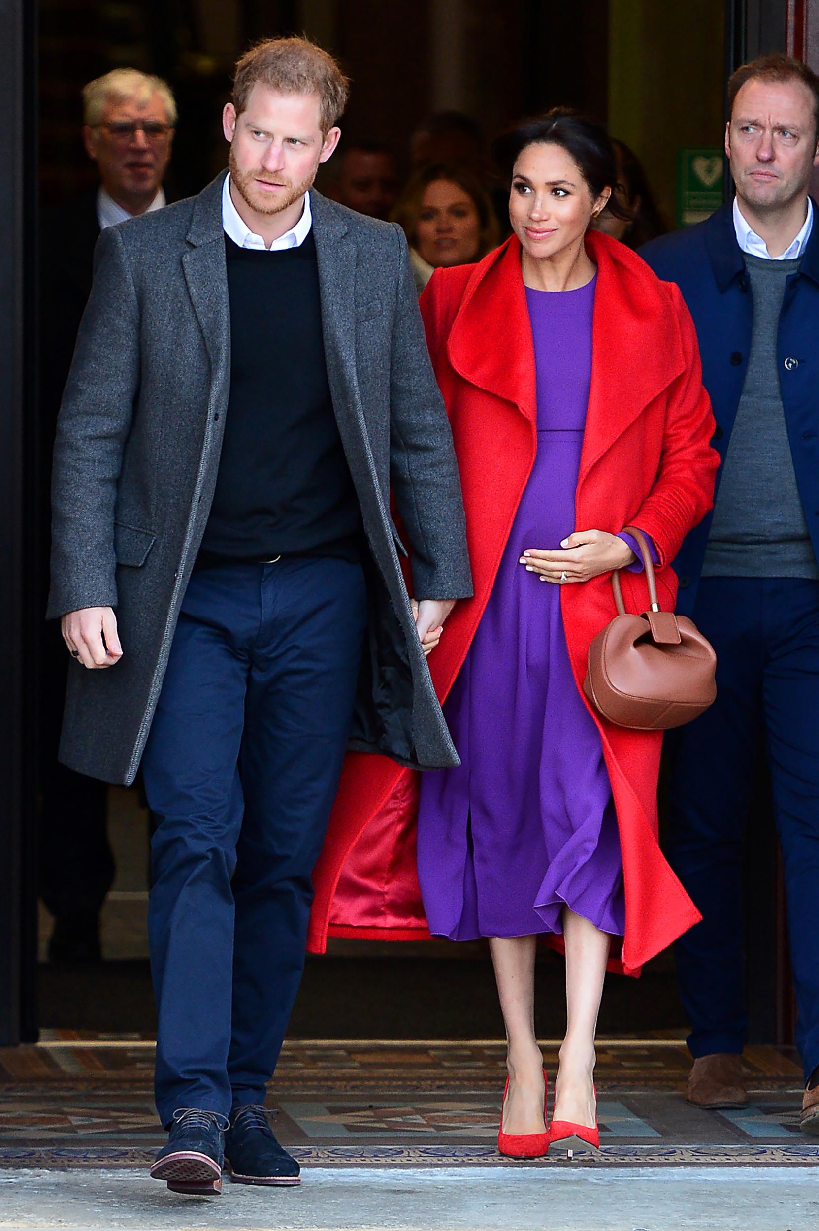 In an unusual style choice for the Duchess, who traditionally favours neutral hues, this ensemble offers a vibrant twist on the colour-blocking trend with a red Sentaler coat, matching heels and a bright purple Aritzia dress. It was a playful choice for the royal couple's visit to Birkenhead Town Hall.