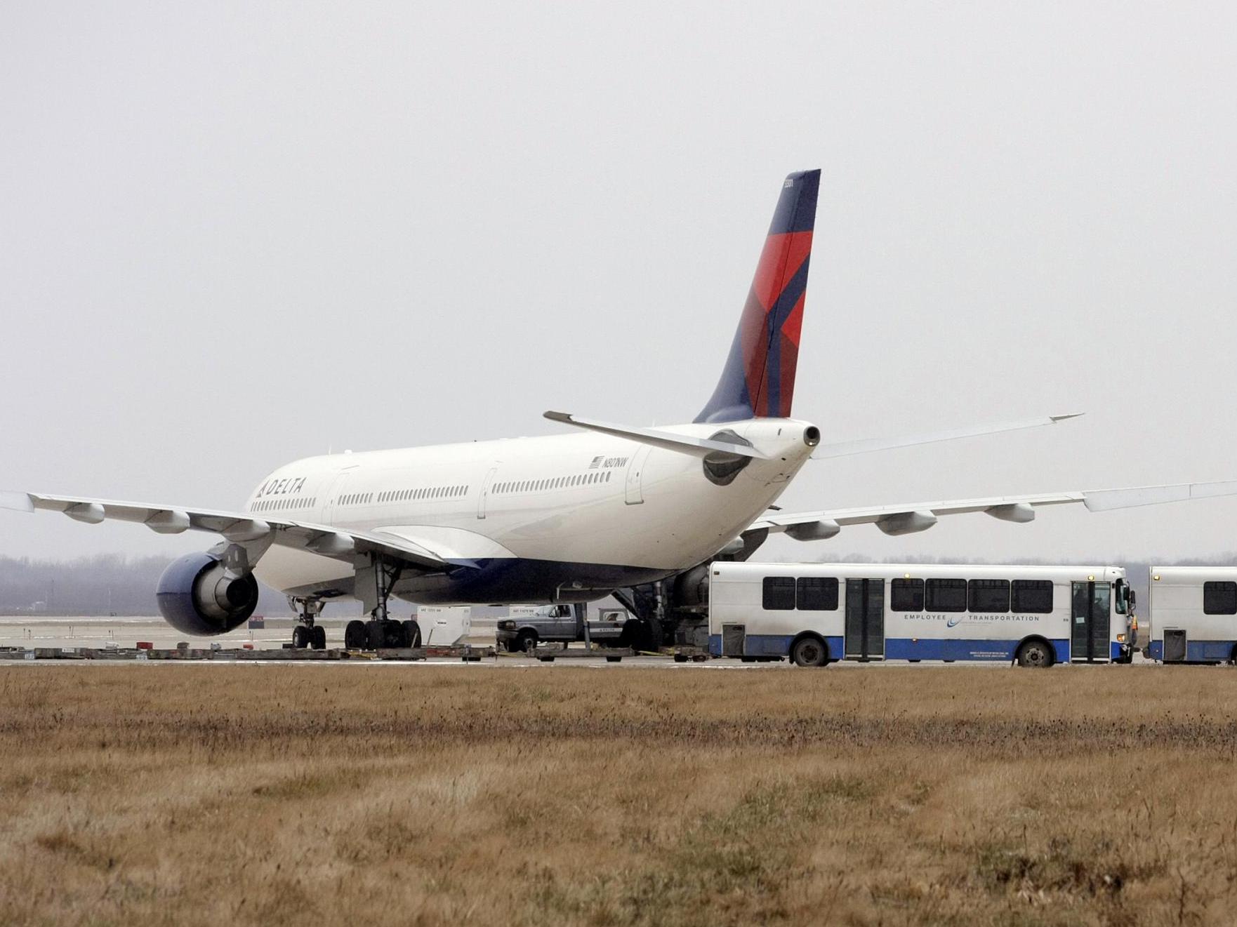 A Delta Airlines jet sits at the Detroit Metropolitan Airport in 2009