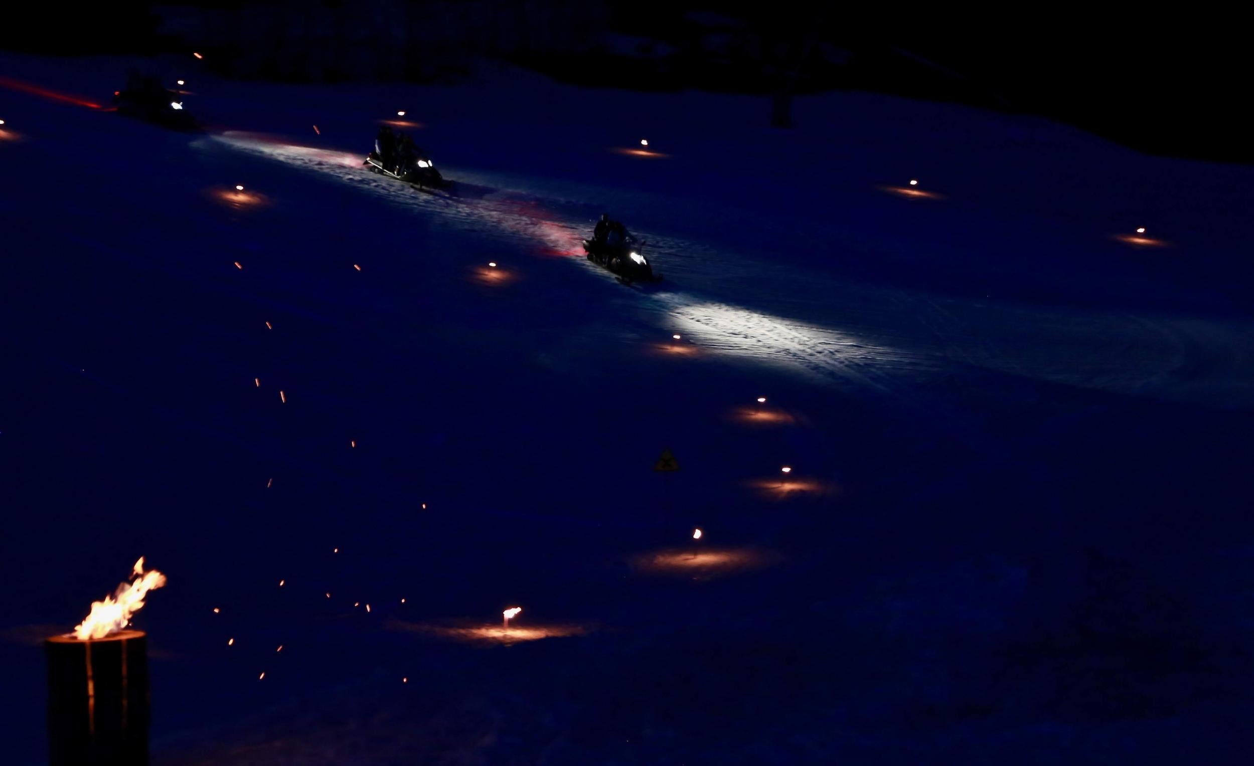 Guests take a nail-biting ride via skidoo to the mountain restaurant