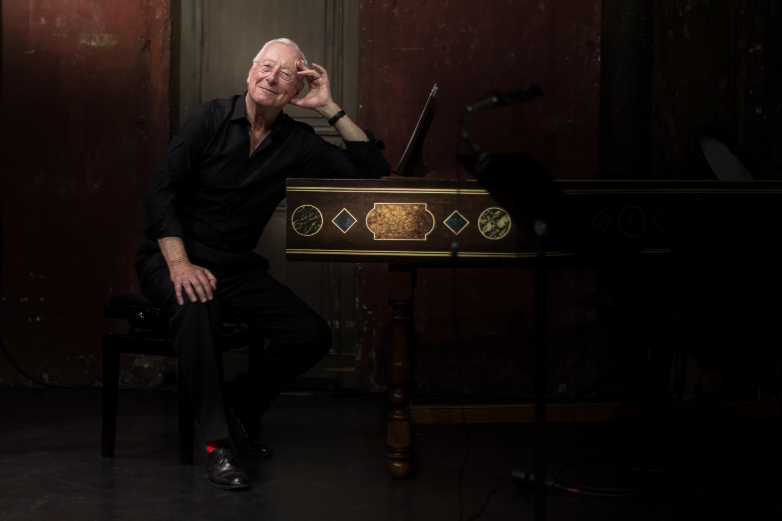 William Christie conducts the work from the keyboard of his harpischord