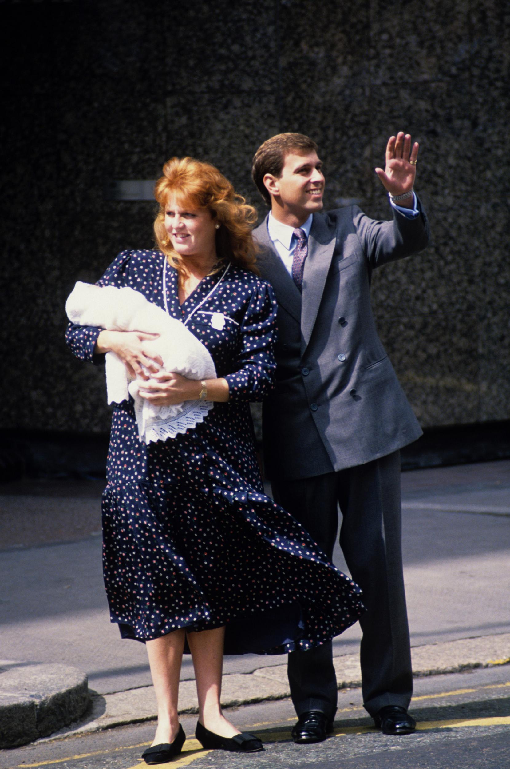 On 8 August 1988, Sarah Ferguson and Prince Andrew welcomed their new baby daughter Princess Beatrice Elizabeth Mary at the Portland Hospital.
The Duchess of York, who wore a navy floral print midi dress for the family's first outing, swaddled the baby in a white blanket.