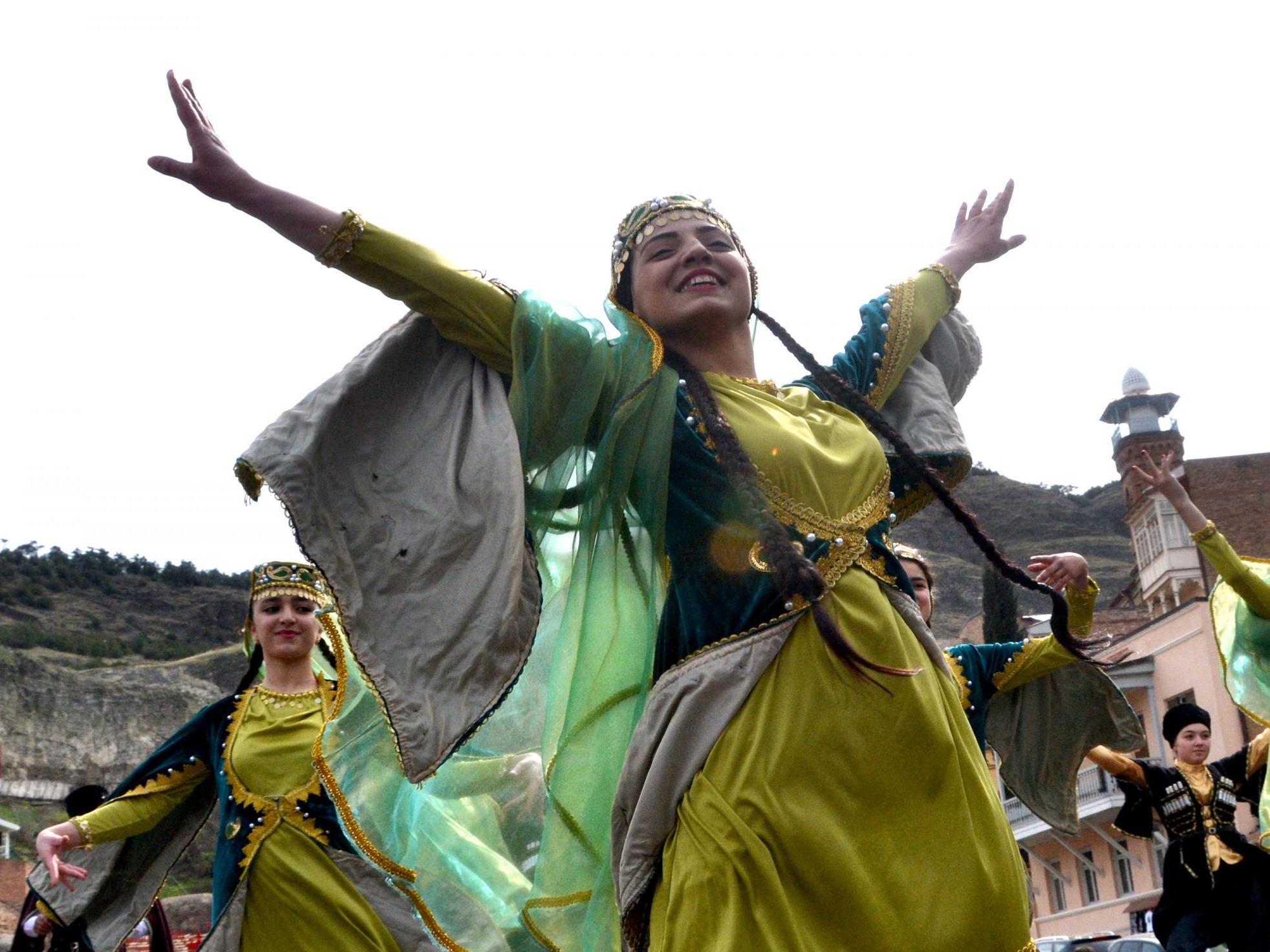 Members of the Azeri diaspora in Georgia wearing traditional costumes dance as they celebrate Nowruz in Tbilisi on 21 March 2017