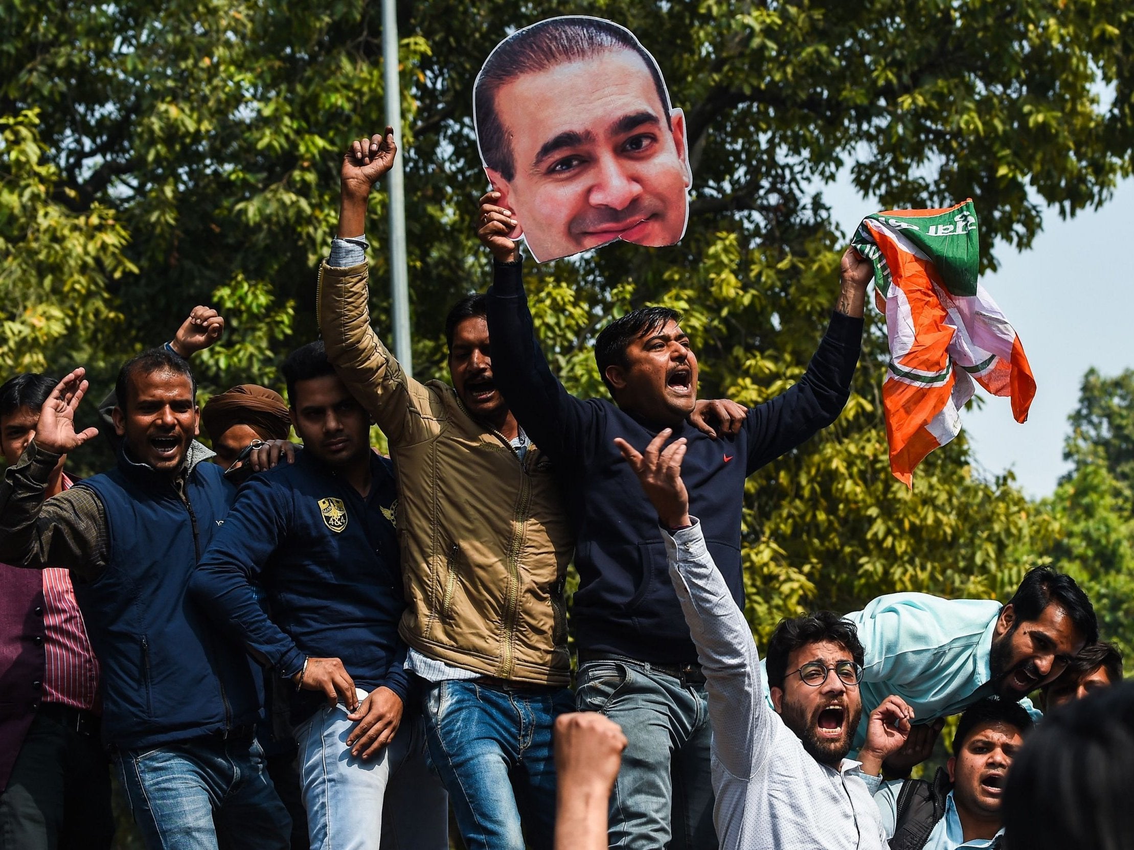 File. Supporters of the opposition Congress party shout slogans against fugitive jeweller Nirav Modi during a protest in New Delhi on 16 February 2018