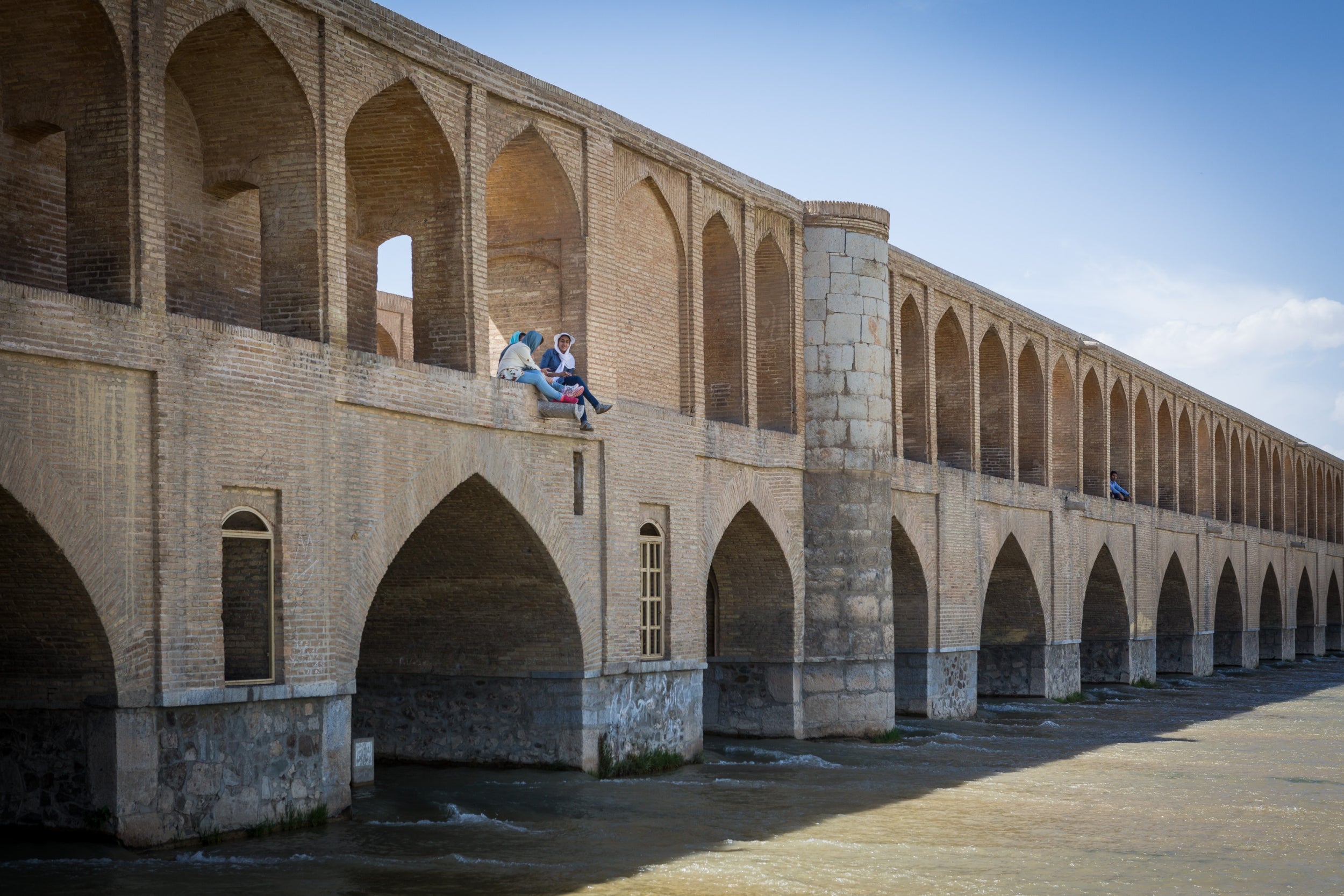 Women on the Si-o-se-pol bridge over the Zayanderude river in Esfahan