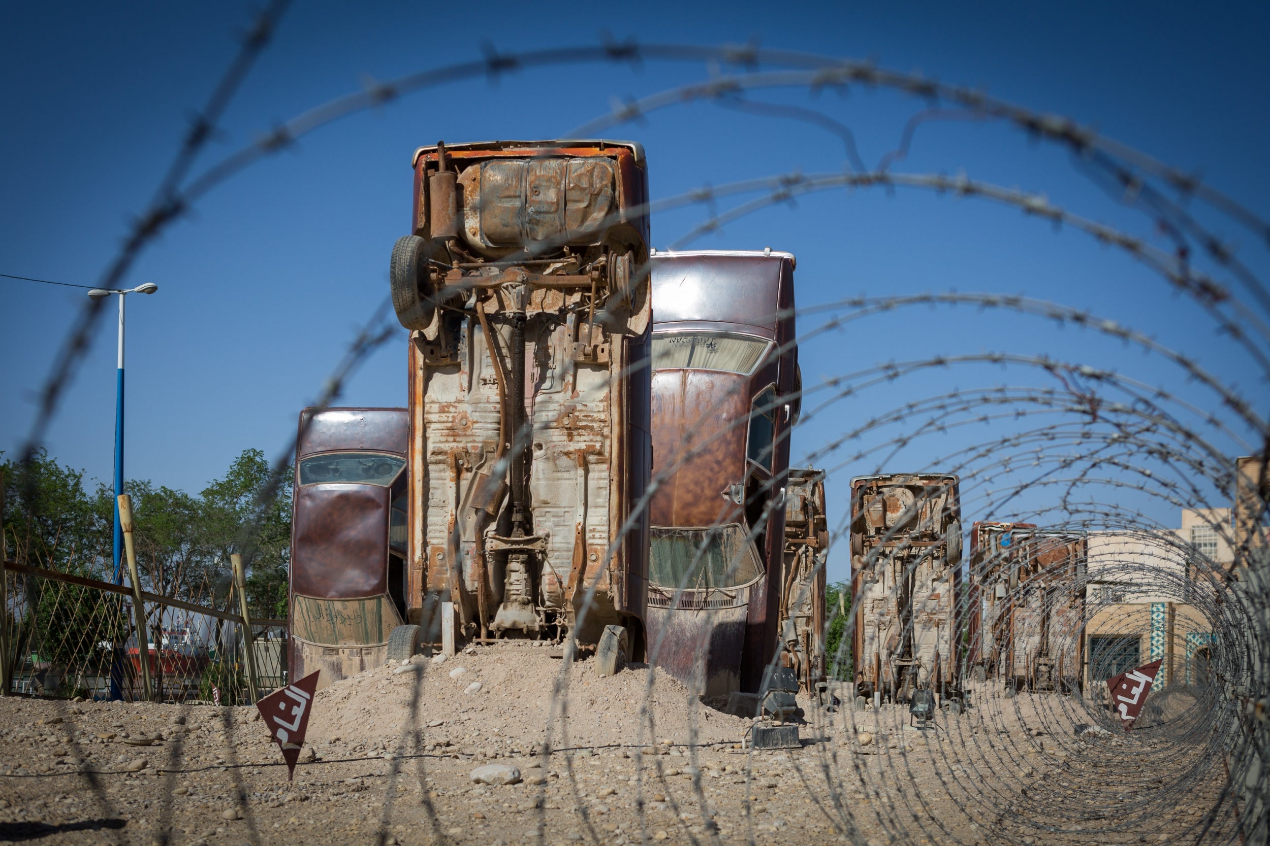 Cars cemented in at the Holy Defence Museum-Garden in Khorramshahr – in 1980 occupying Iraqi forces used such formations to deter paratrooper landings