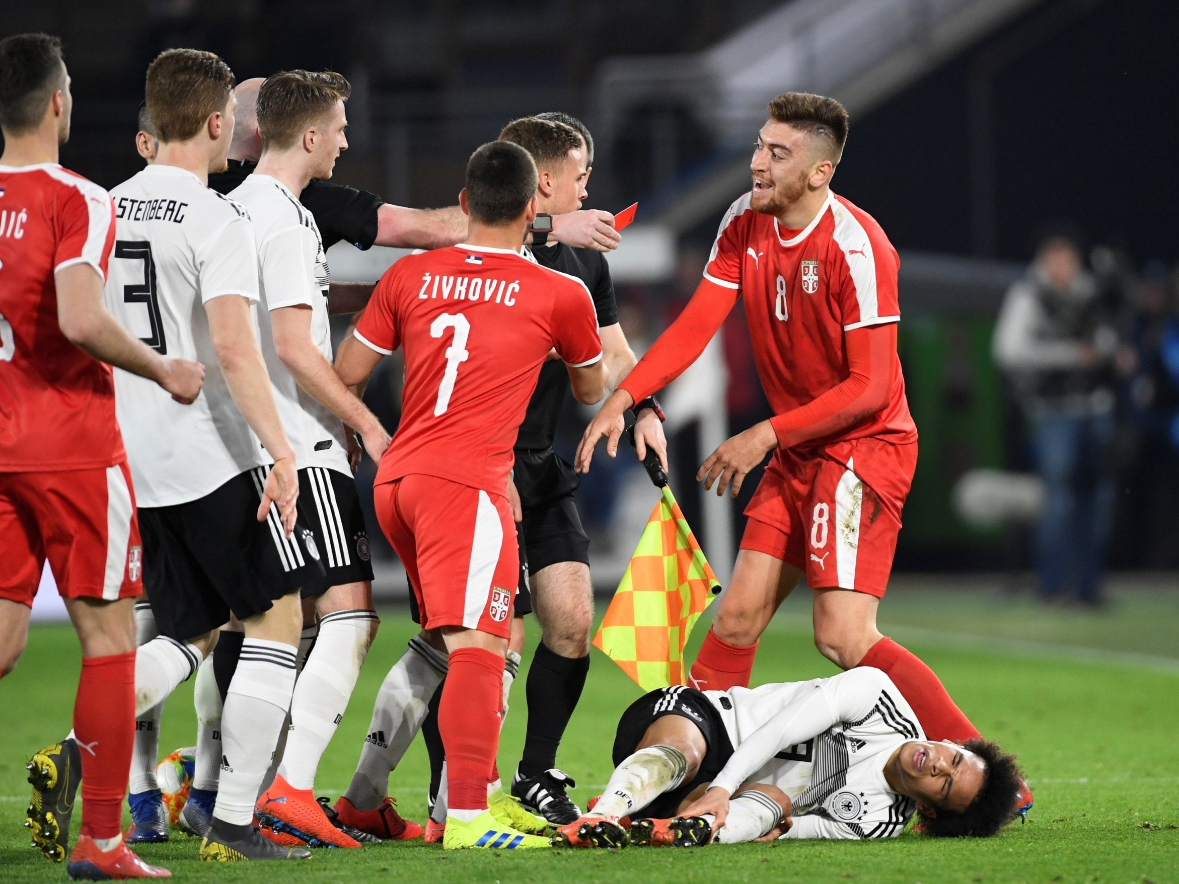 Sane was injured by Serbia's Milan Pavkov late on