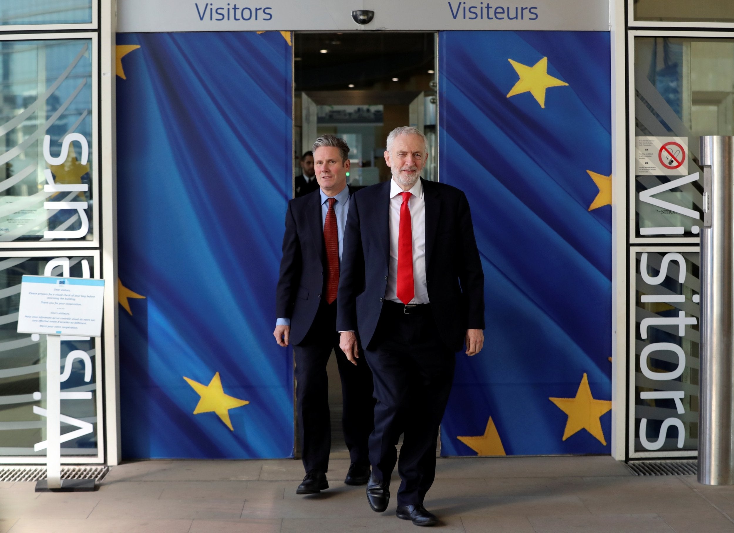 Jeremy Corbyn and Keir Starmer leave the European Commission headquarters in Brussels after a meeting