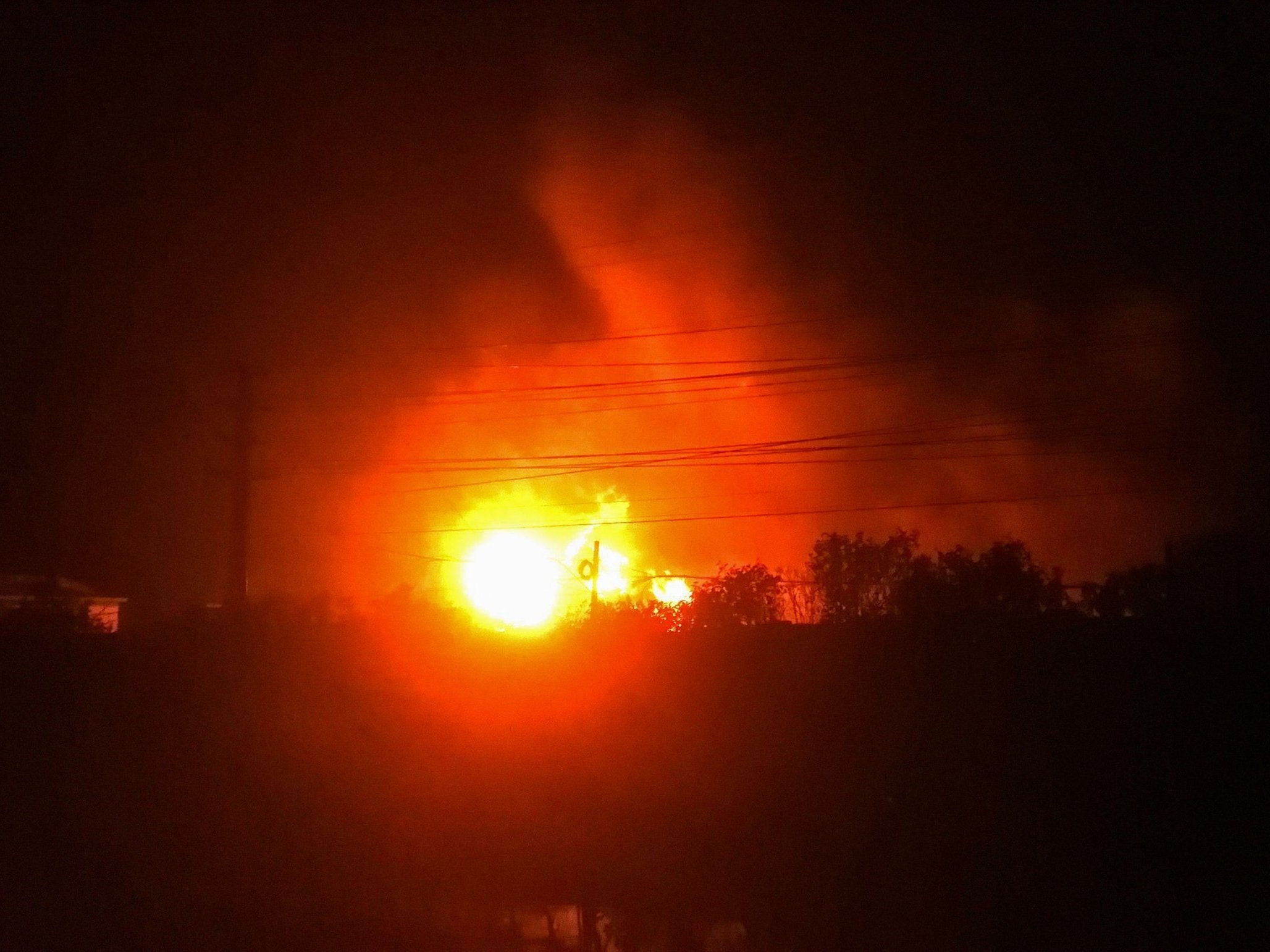 Fire and smoke rise from the site of an explosion at a pesticides factory in Yancheng