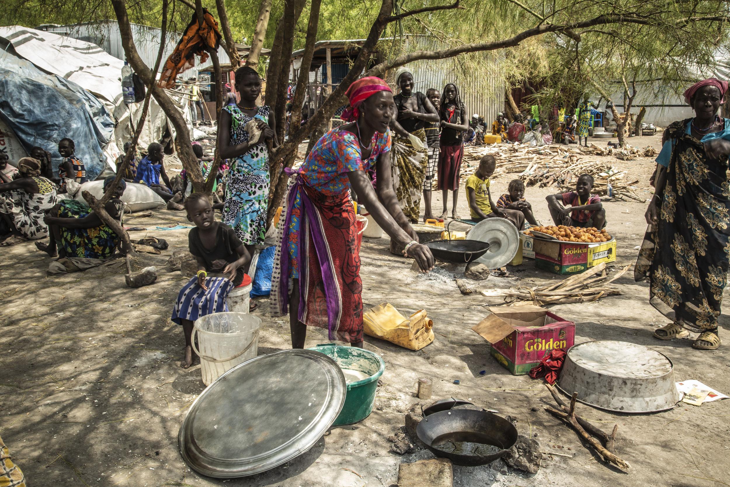 Women in Pibor’s market try to earn a living by selling items such as water and bush fruit