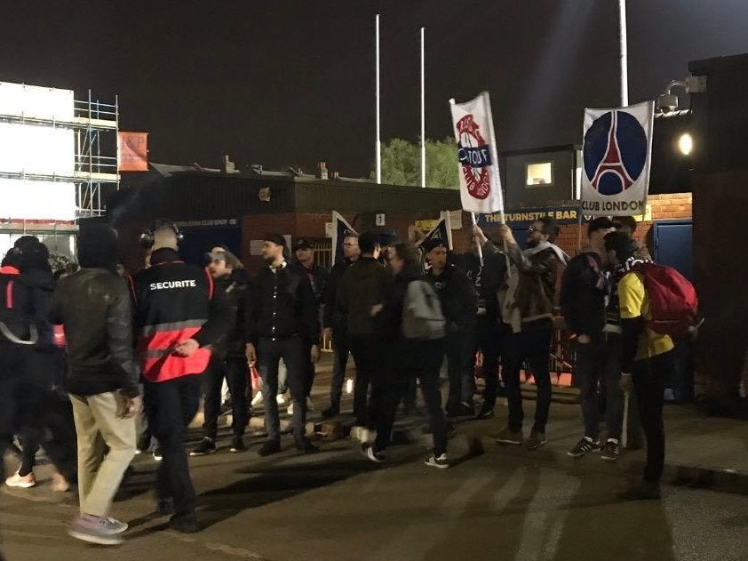 PSG fans attend the Champions League match