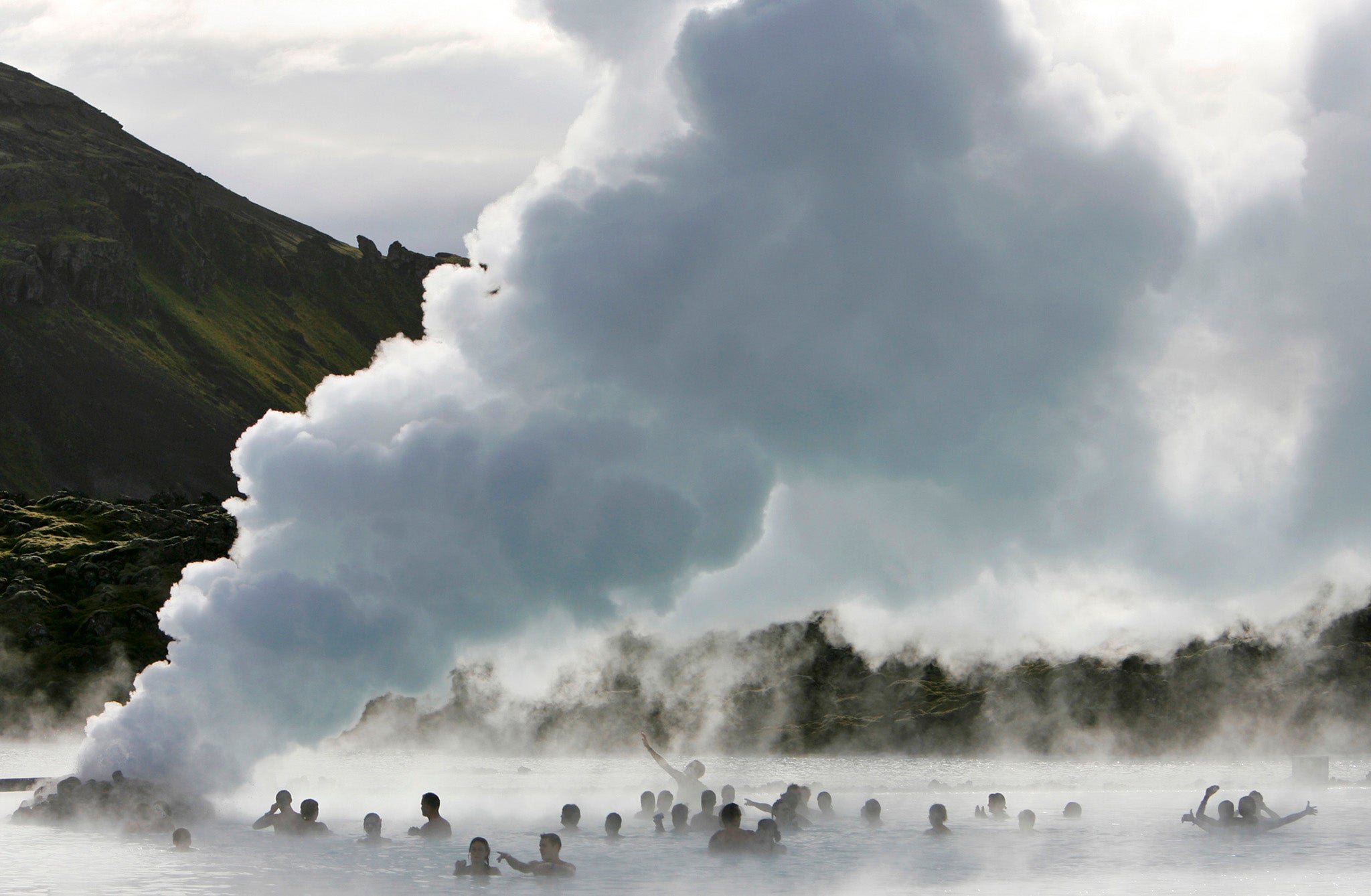 Bathers in Iceland's Blue Lagoon hot springs