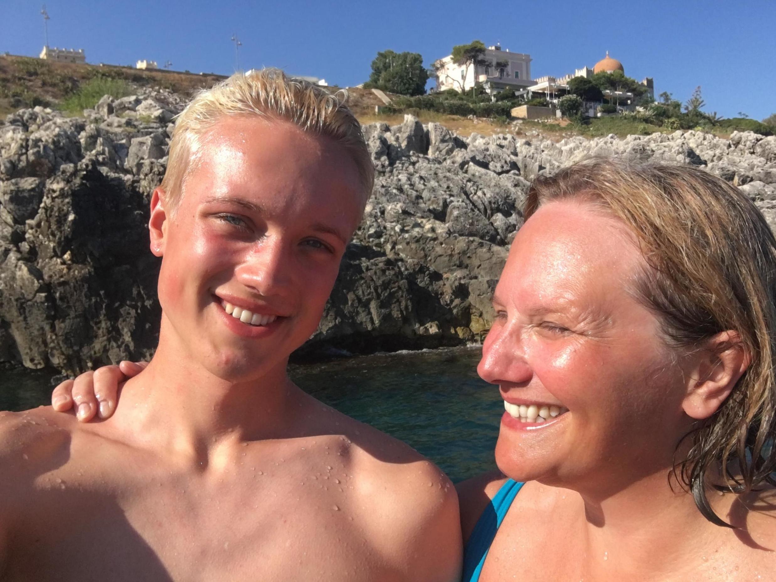 Dom with his mother Pat on holiday, just months before he killed himself