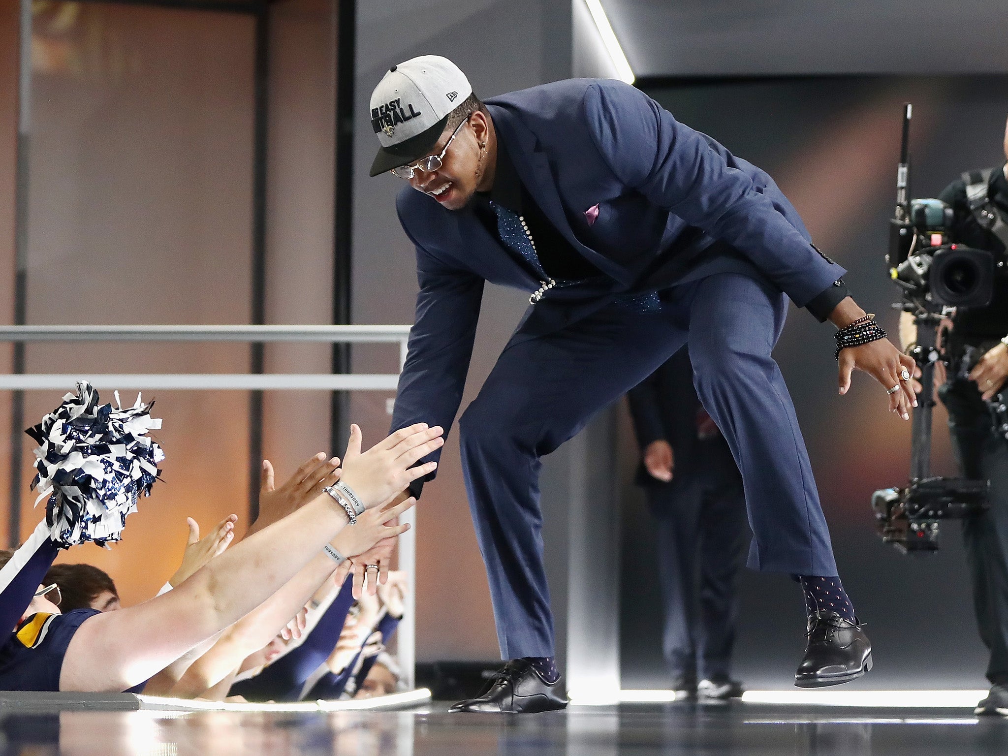 Marcus Davenport of University of Texas San Antonio high fives fans after being picked number 14 overall by the New Orleans Saints during the first round of the 2018 NFL Draft (Getty)