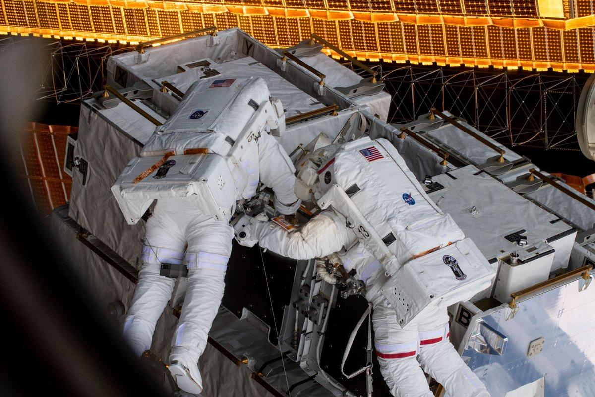 NASA astronauts Anne McClain (R) and Nick Hague are seen during Friday's spacewalk in this social media photo from the International Space Station posted on March 25, 2019