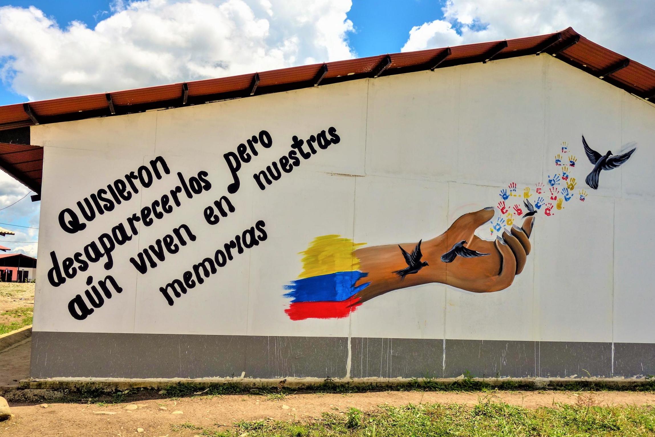 ‘They wanted them to disappear, but they live on in our memories’, reads a mural in Camp Mariana Paez (William Ospina Ramírez /The Independent)