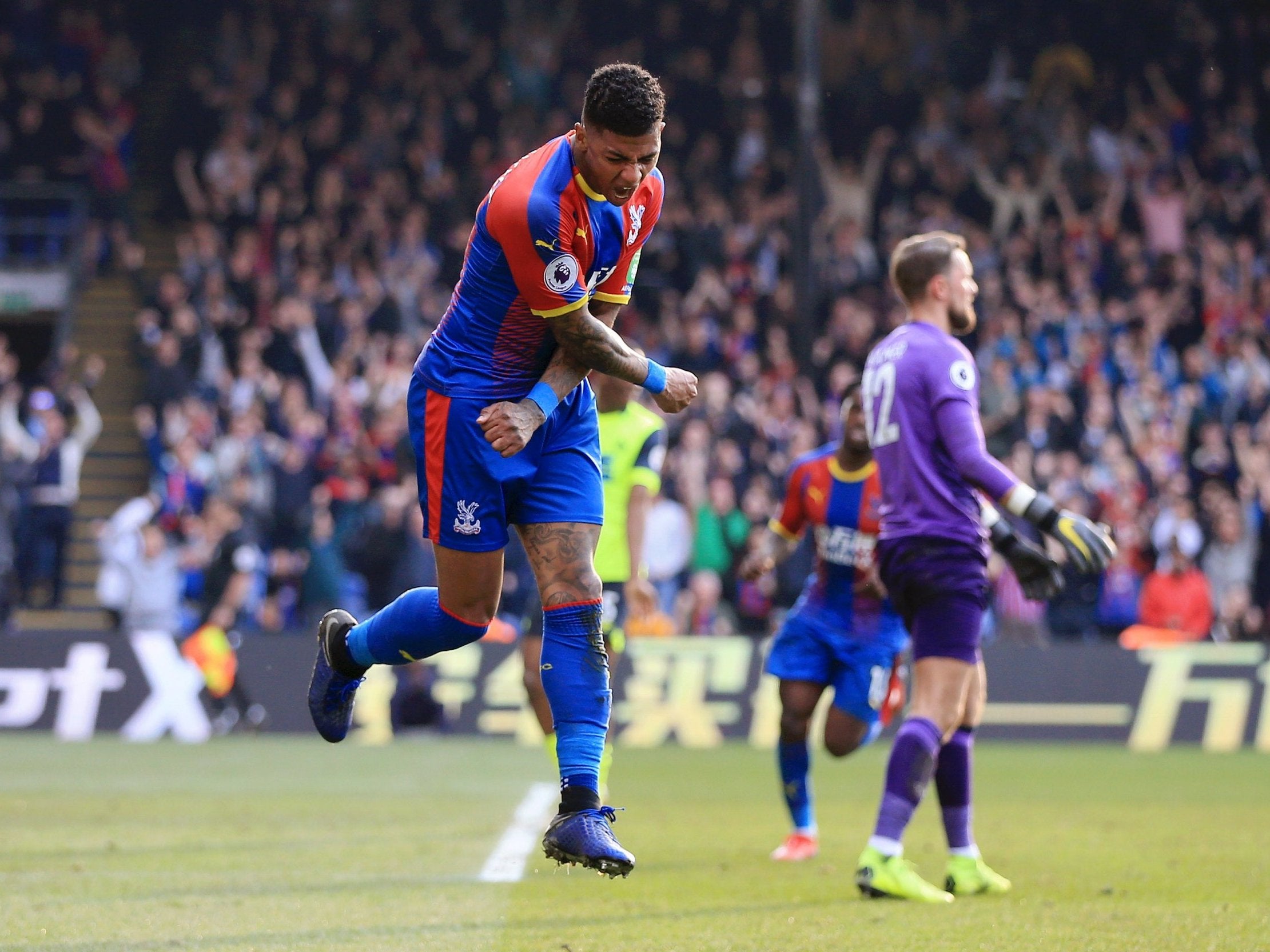 Patrick van Aanholt celebrates doubling Crystal Palace's lead over Huddersfield