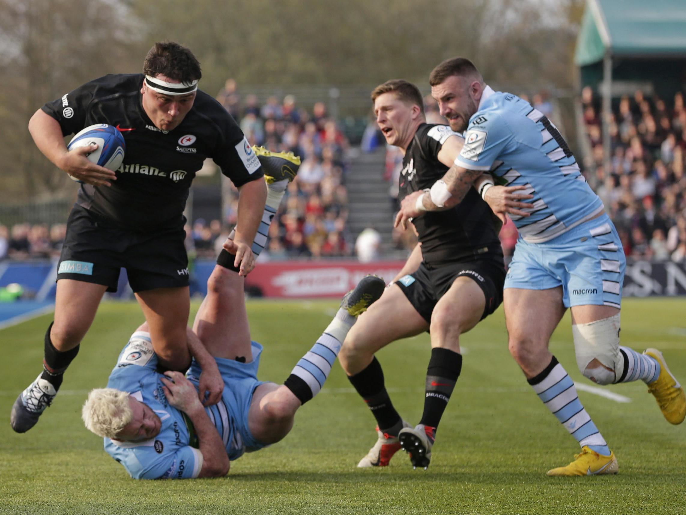 Jamie George tries to make his way past Stuart Hogg