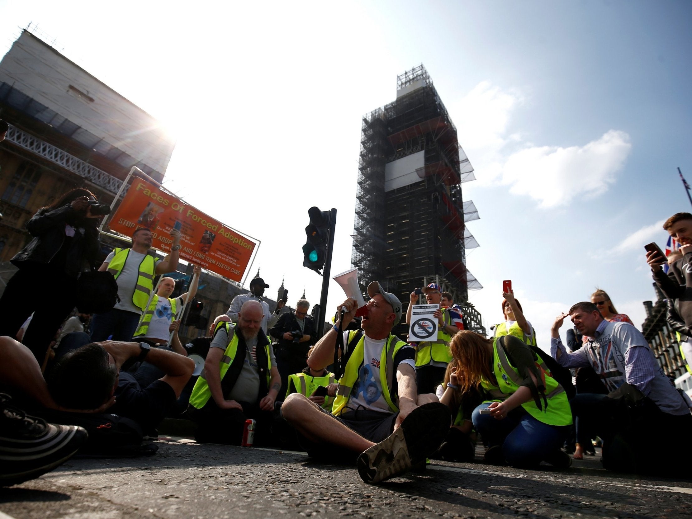 Yellow vest activists with impromptu sit down protest at Westminster Bridge