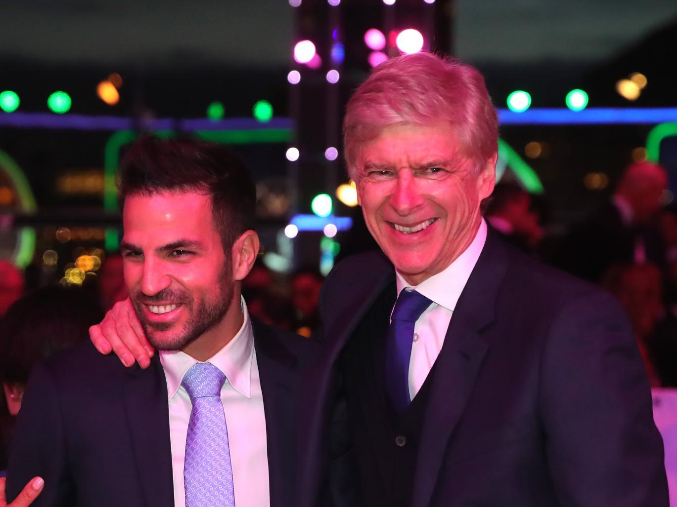 Cesc Fabregas shares a joke with Arsene Wenger