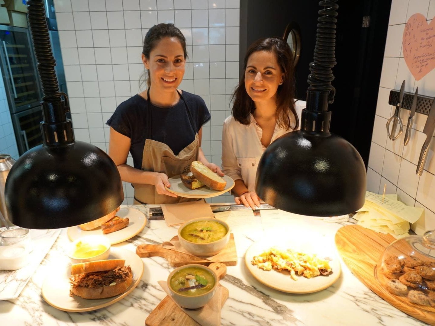 Paulina Escanes cooking with her sister