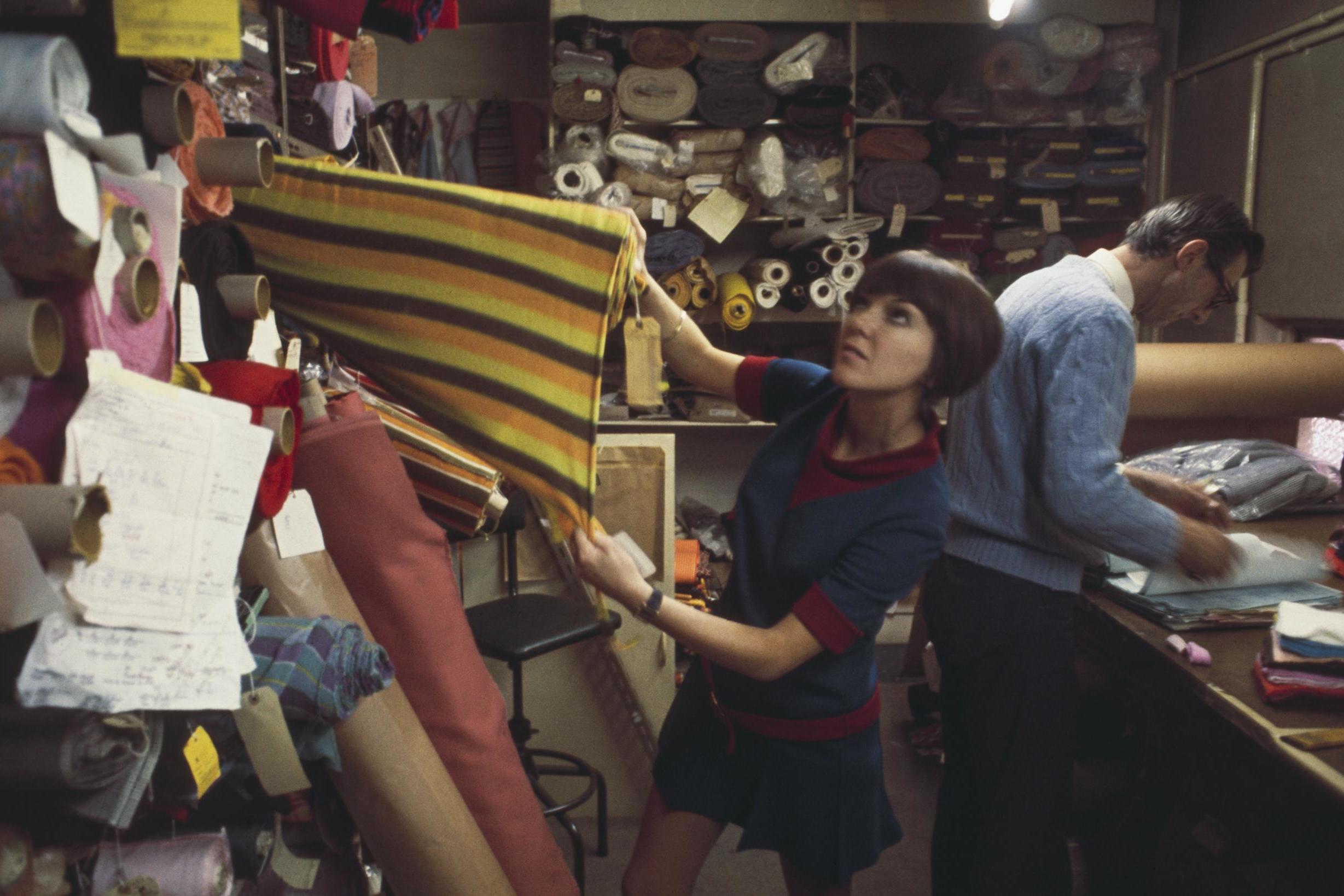 Mary Quant selecting fabric, 1967