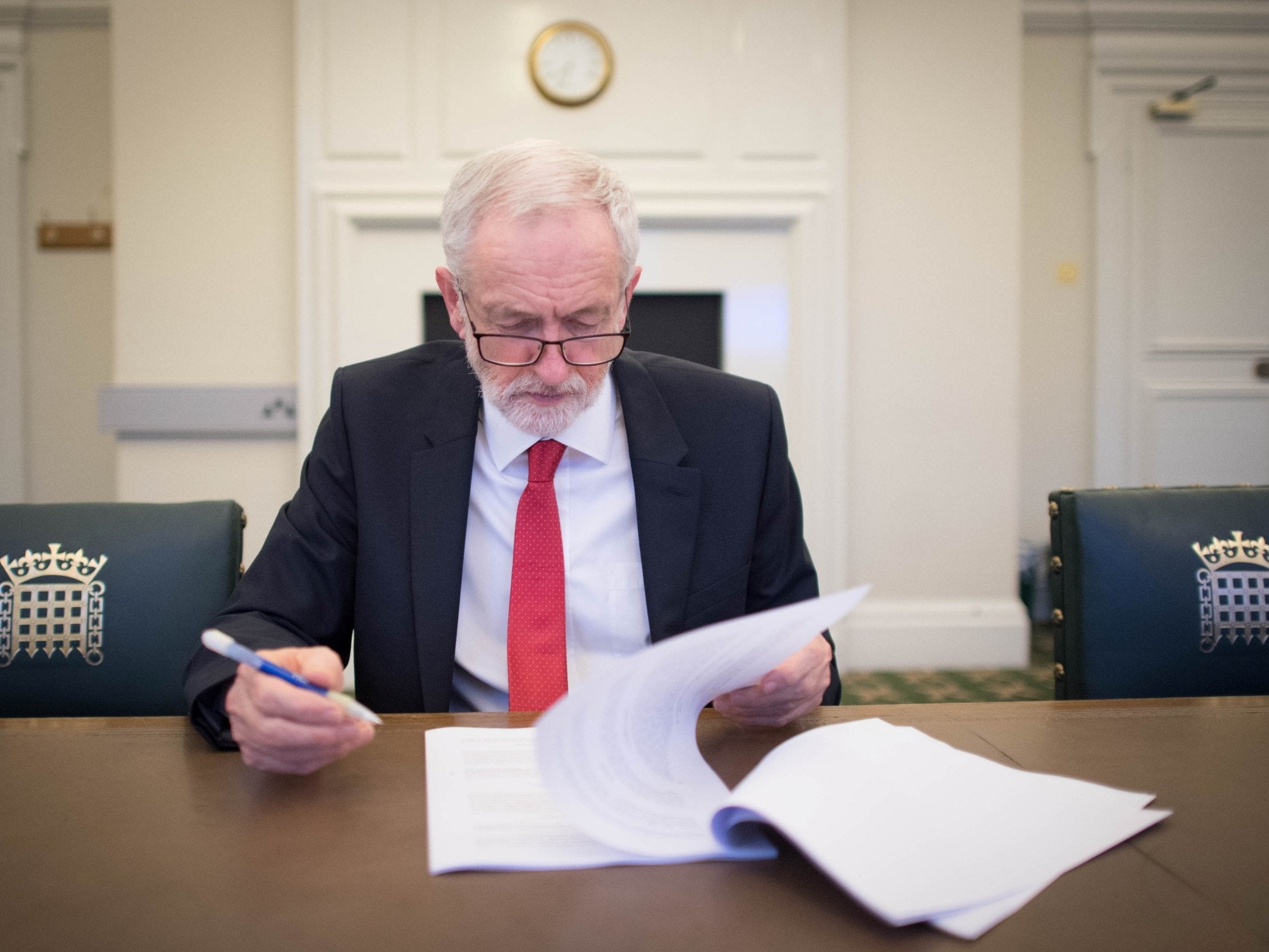 Labour leader Jeremy Corbyn looks at the Political Declaration, setting out the framework for the future UK-EU relations, at his office in the Houses of Parliament