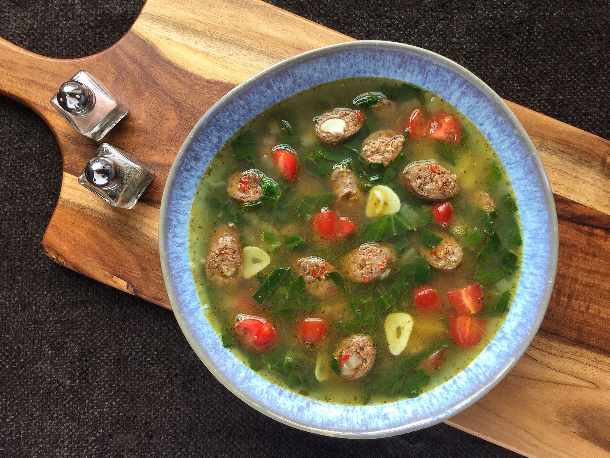 Spinach and potato soup with spicy Merguez sausages