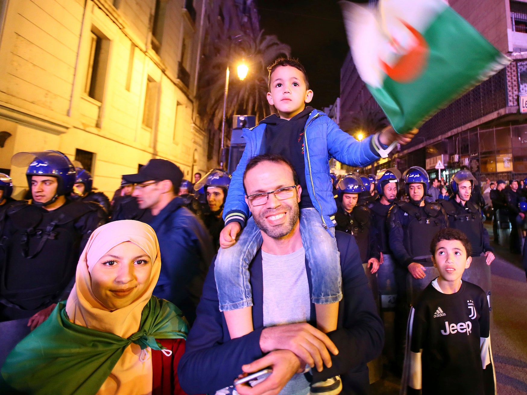 Algerians celebrate after the resignation Tuesday night of Algerian president Abdelaziz Bouteflika